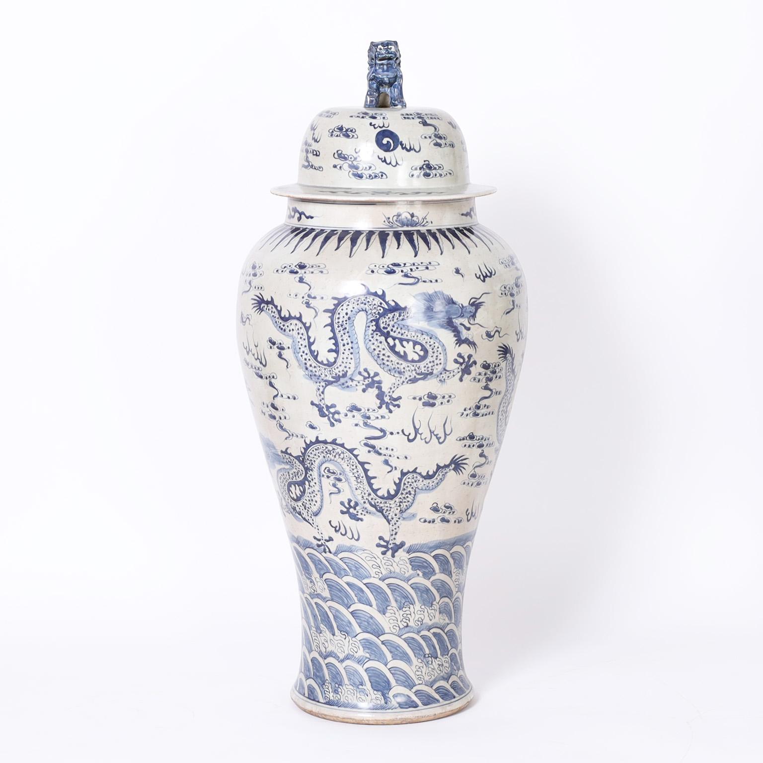 Chinese Export Pair of Blue and White Lidded Palace Urns with Dragons