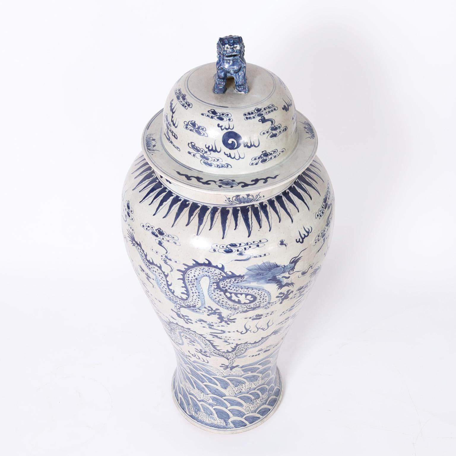 Chinese Pair of Blue and White Lidded Palace Urns with Dragons