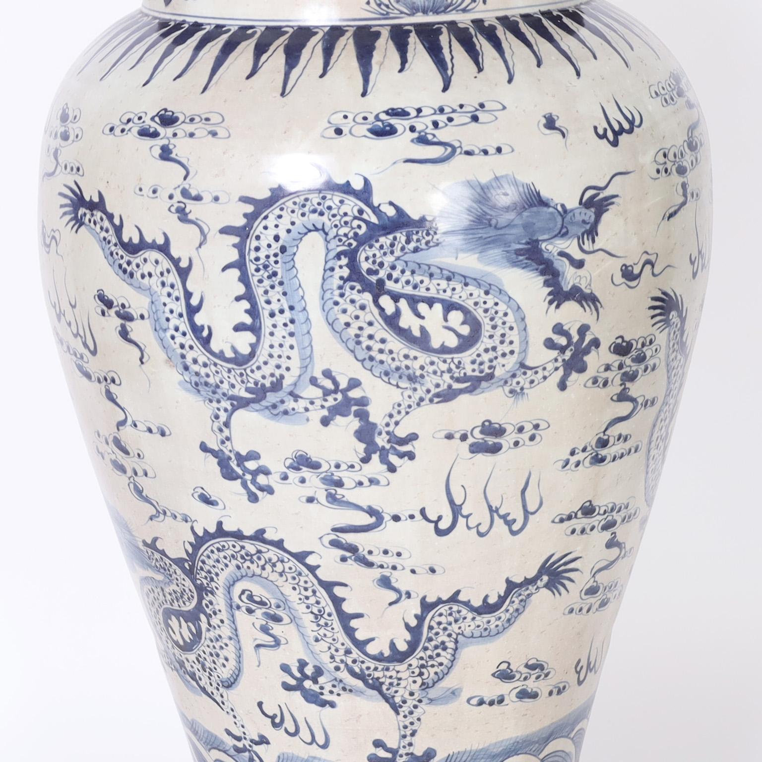 Glazed Pair of Blue and White Lidded Palace Urns with Dragons