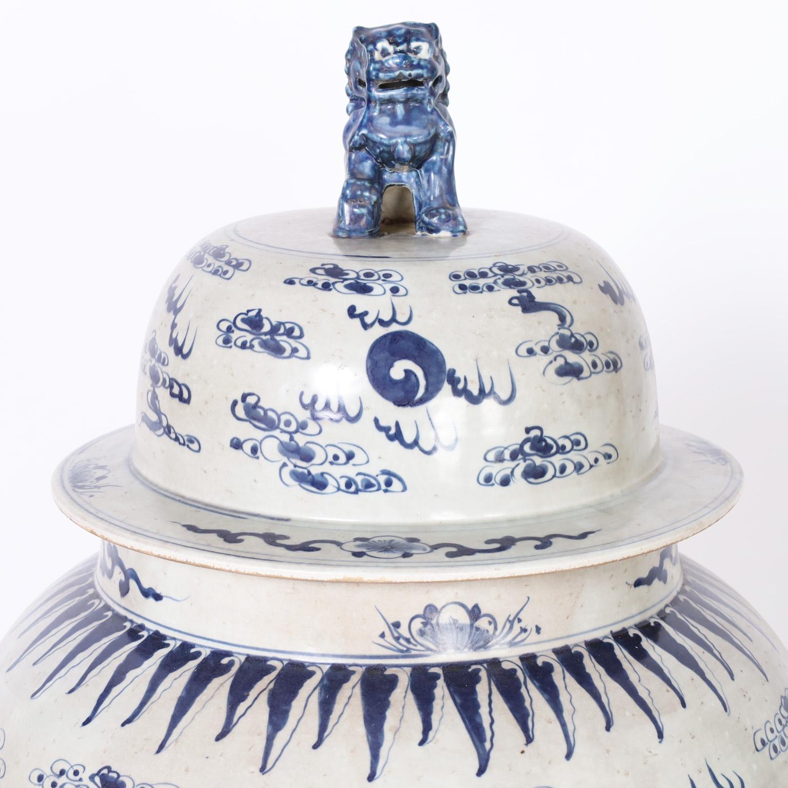 20th Century Pair of Blue and White Lidded Palace Urns with Dragons