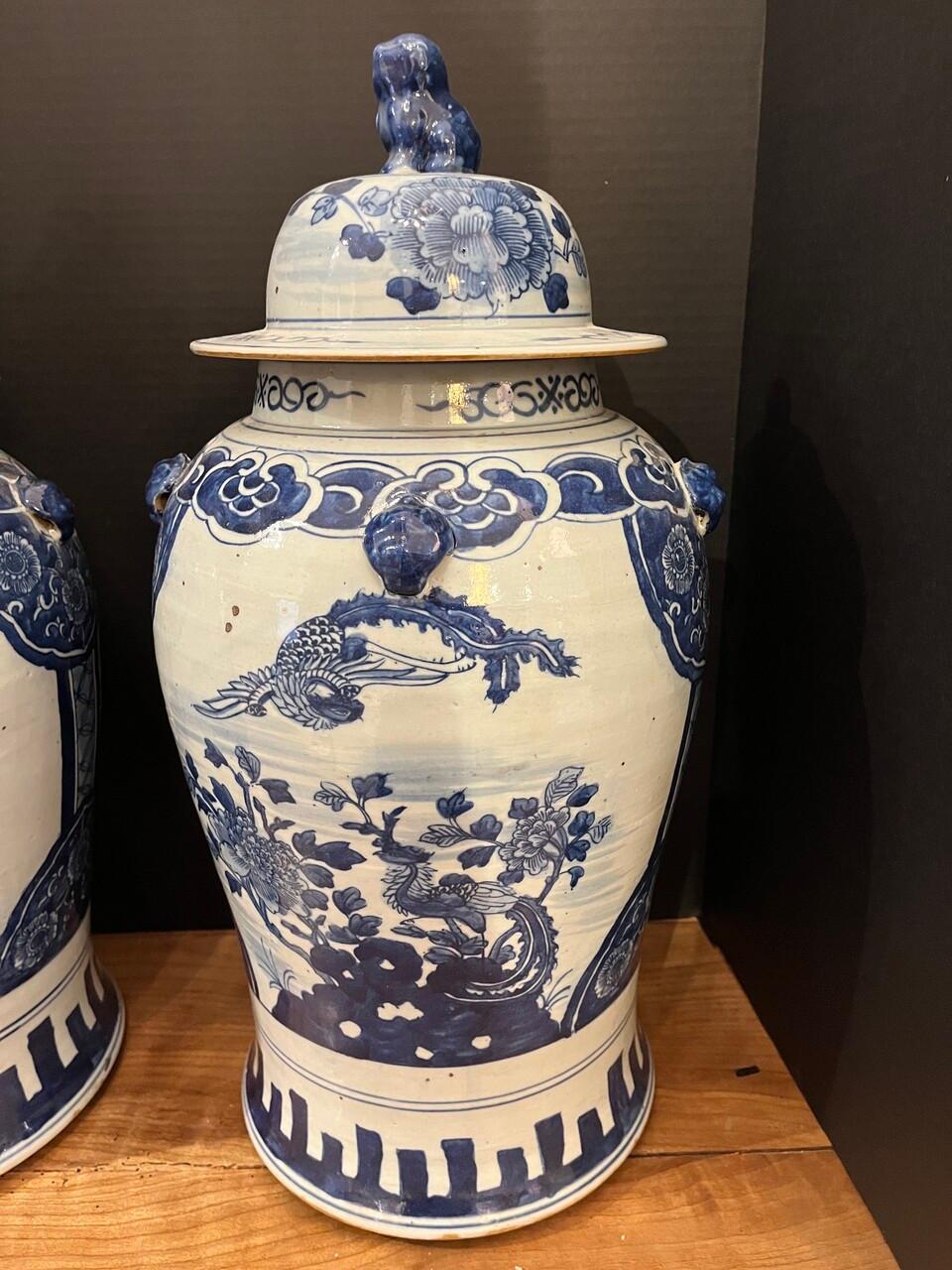 Adorn your space with timeless elegance! These exquisite Blue and White Temple/Ginger Jars feature intricate dragon motifs, symbolizing strength and power, while their lids boast majestic foo dog handles, guarding against negative energy. Crafted