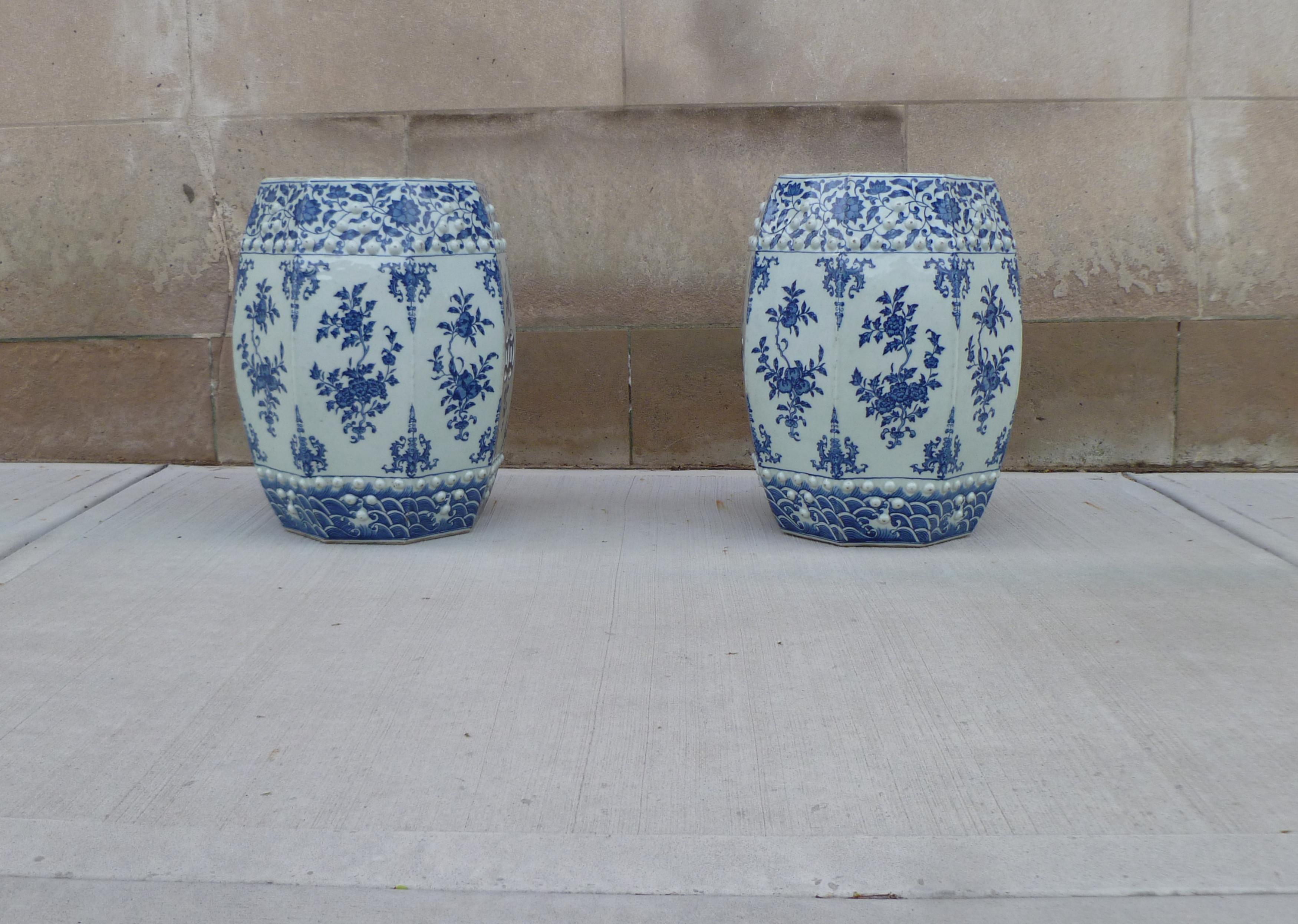 Pair of blue and white porcelain garden seats / end tables with floral motif. We carry fine quality furniture with elegant finished and has been appeared many times in 