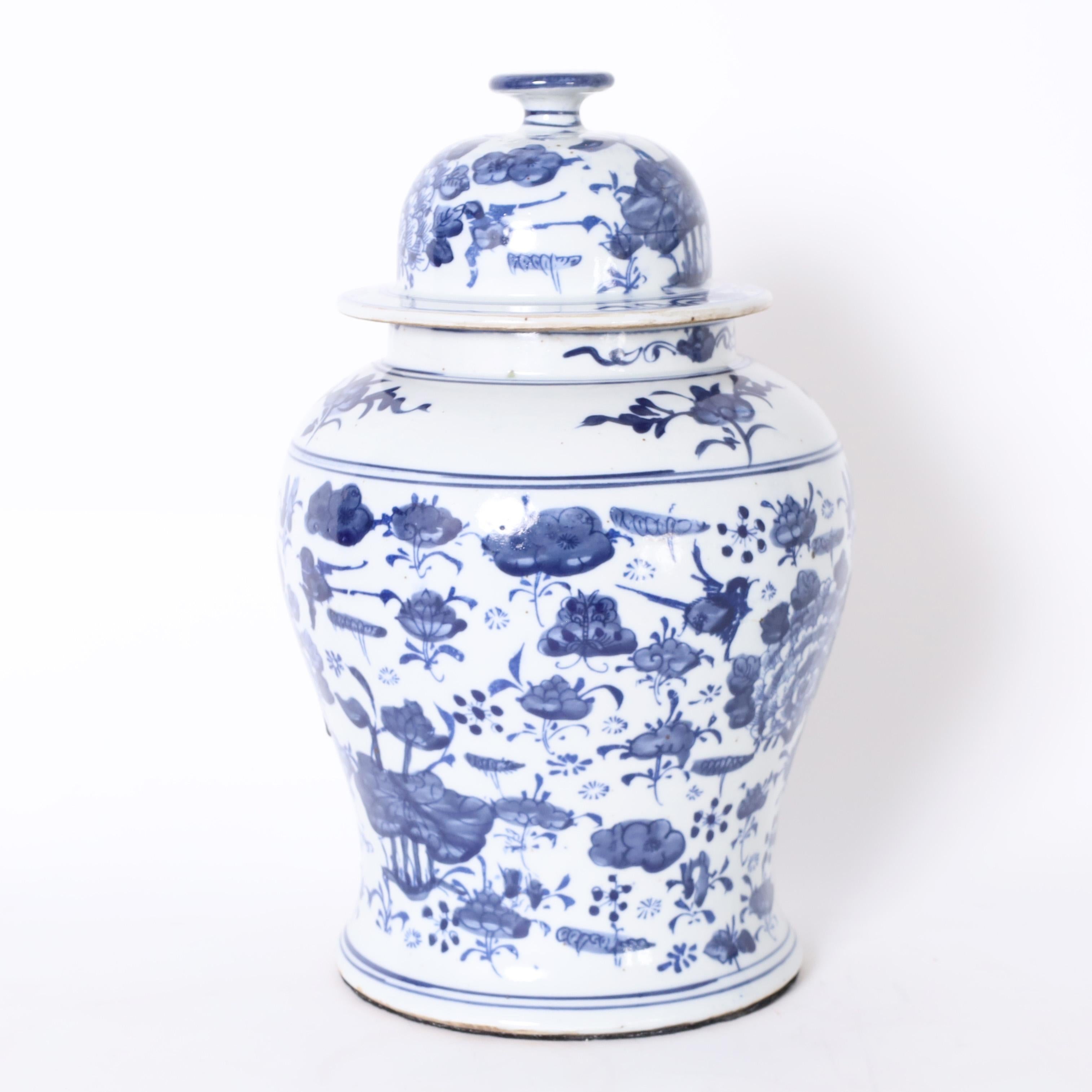 Chinese Export Pair of Blue and White Porcelain Ginger Jars with Birds and Flowers For Sale
