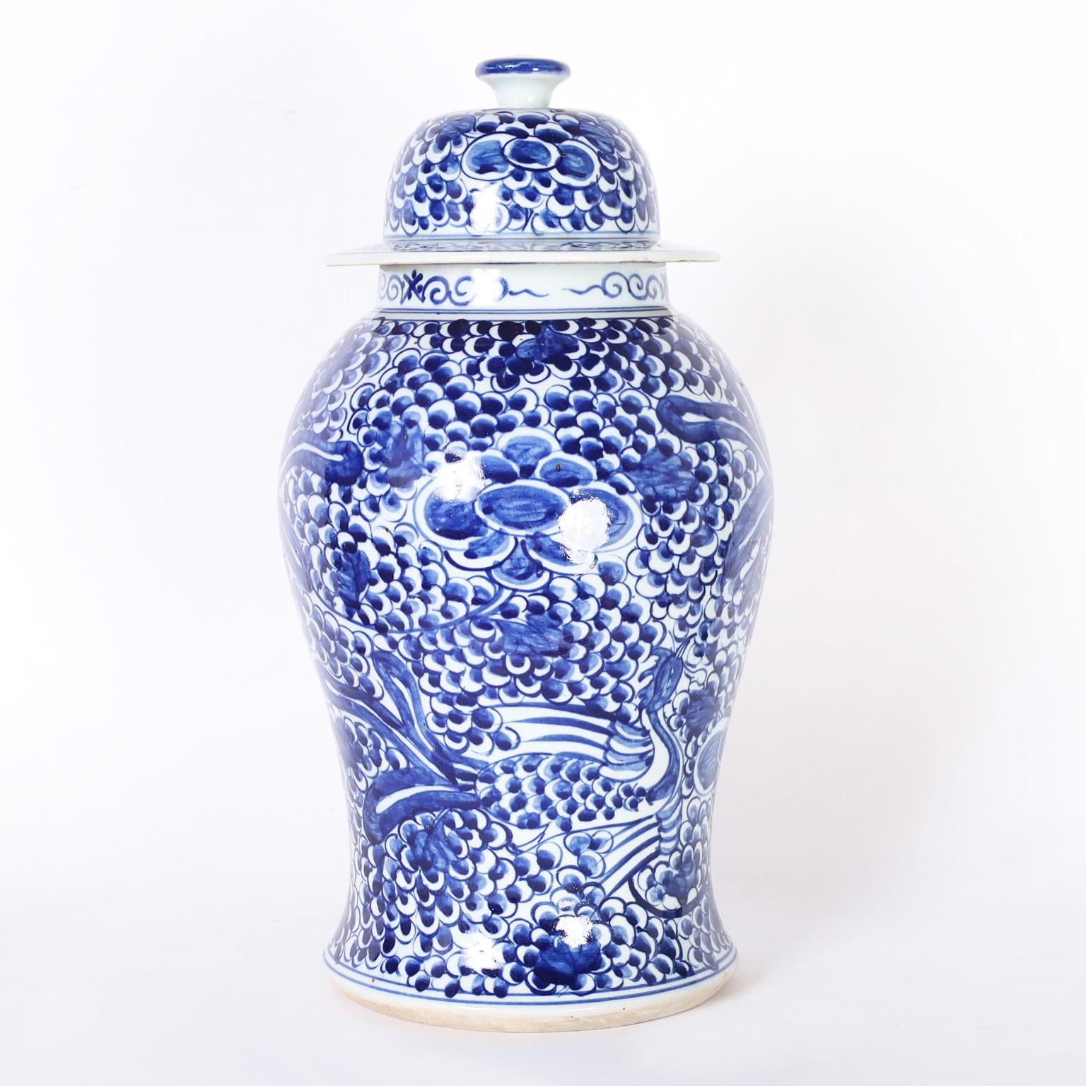 Chinese Export Pair of Blue and White Porcelain Lidded Ginger Jars with Birds & Flowers