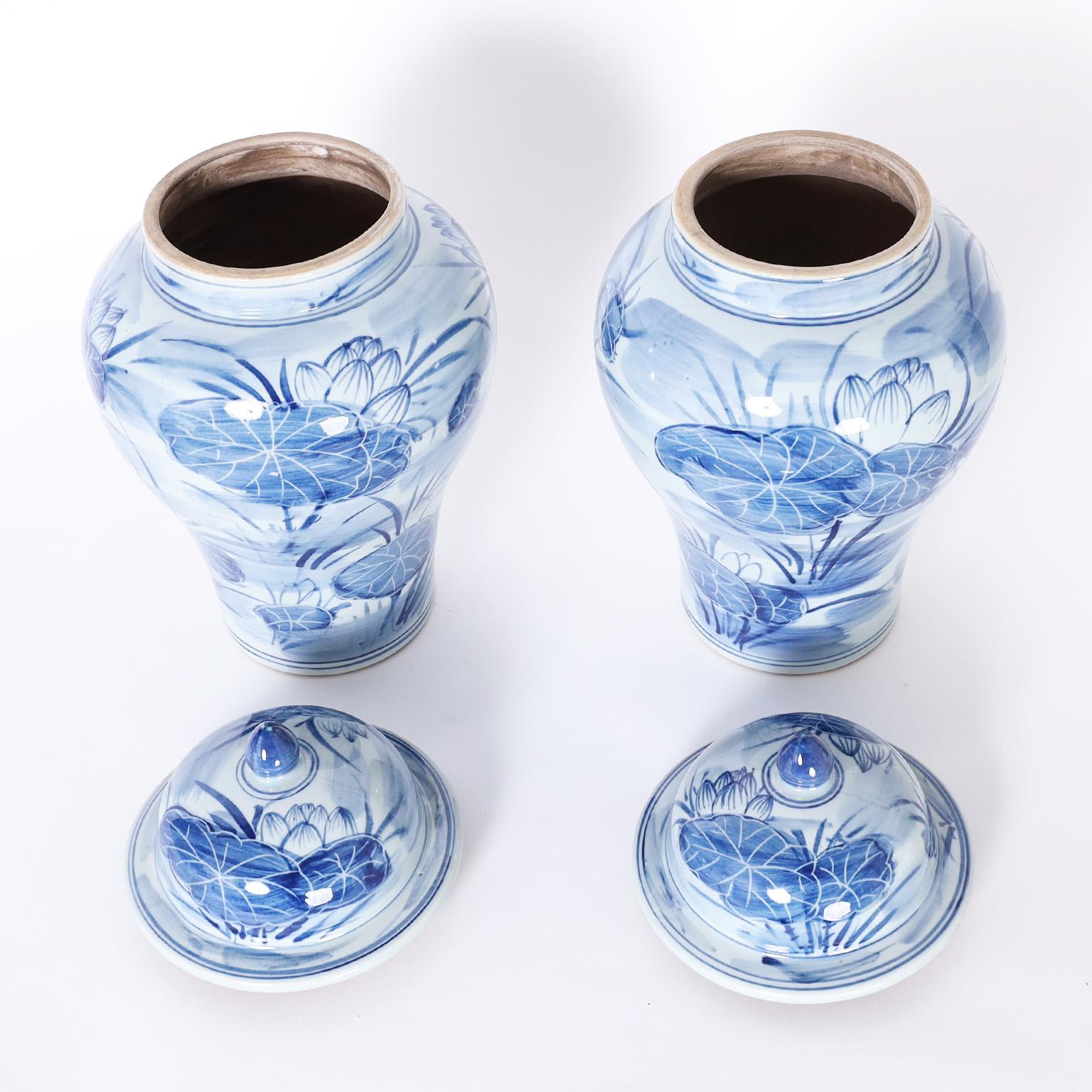 Chinese Export Pair of Blue and White Porcelain Lidded Ginger Jars with Water Lilies