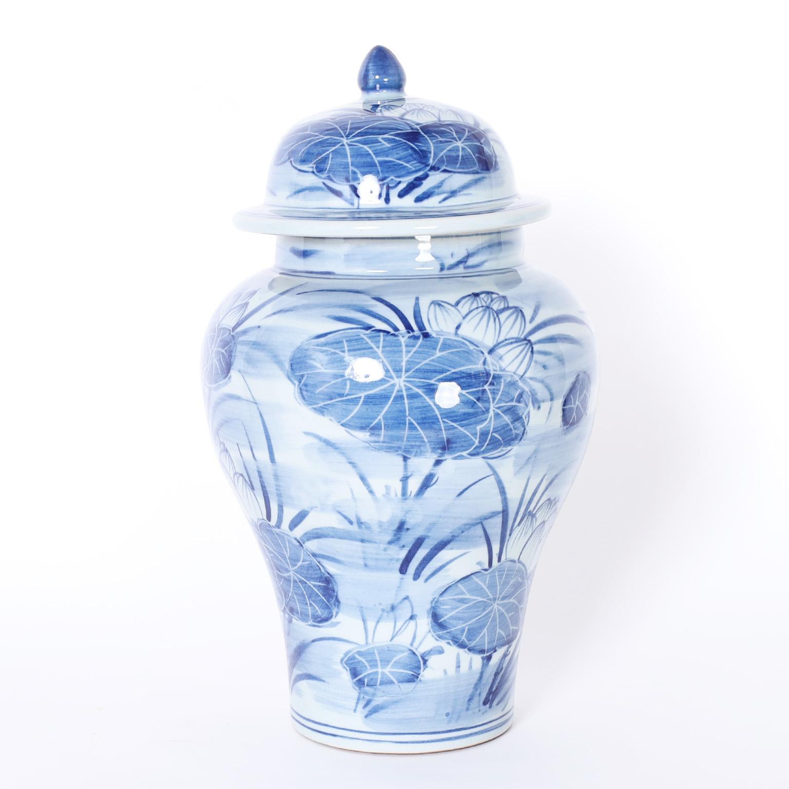 Chinese Pair of Blue and White Porcelain Lidded Ginger Jars with Water Lilies