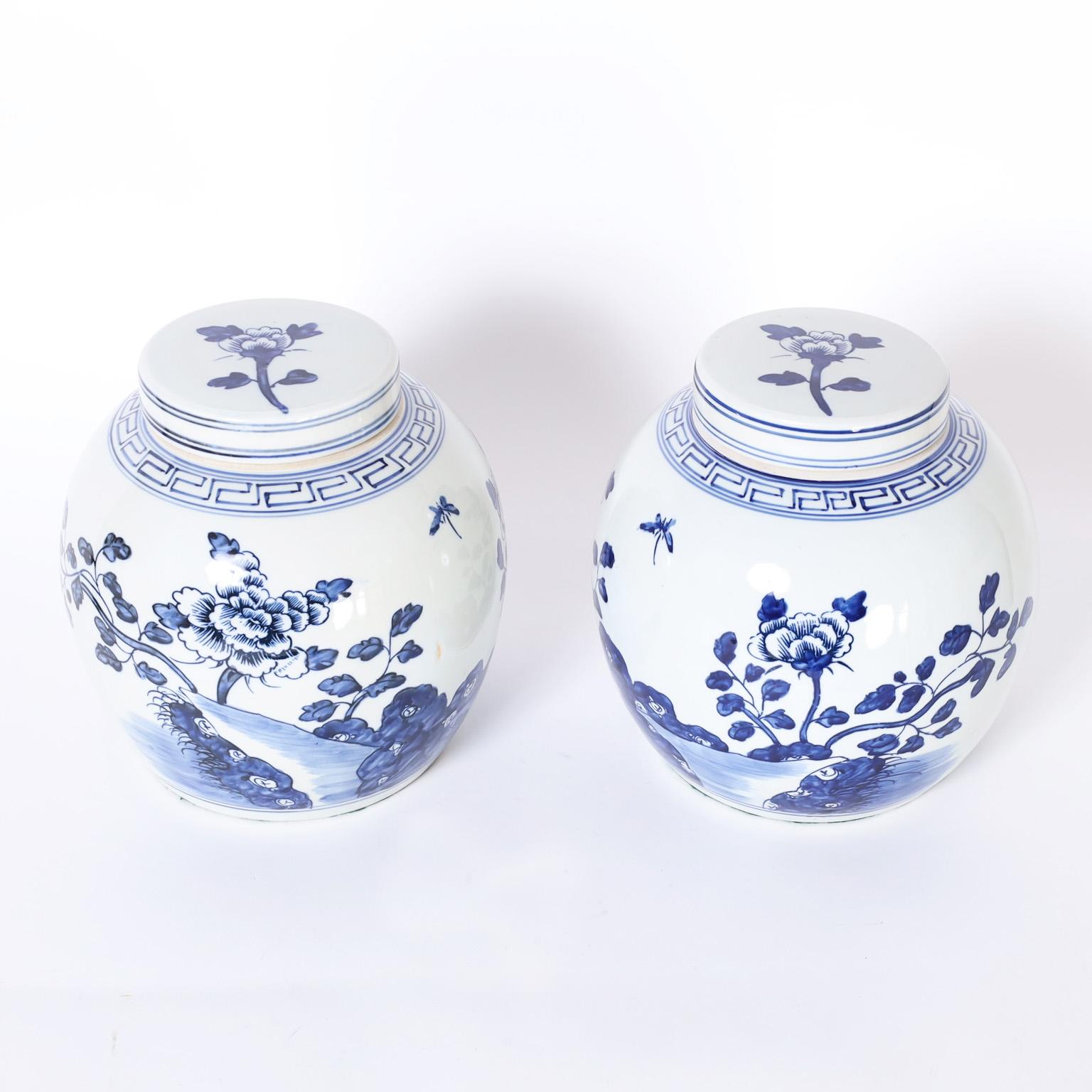 Chinese blue and white porcelain jars with classic form hand decorated with flowers and leaves.