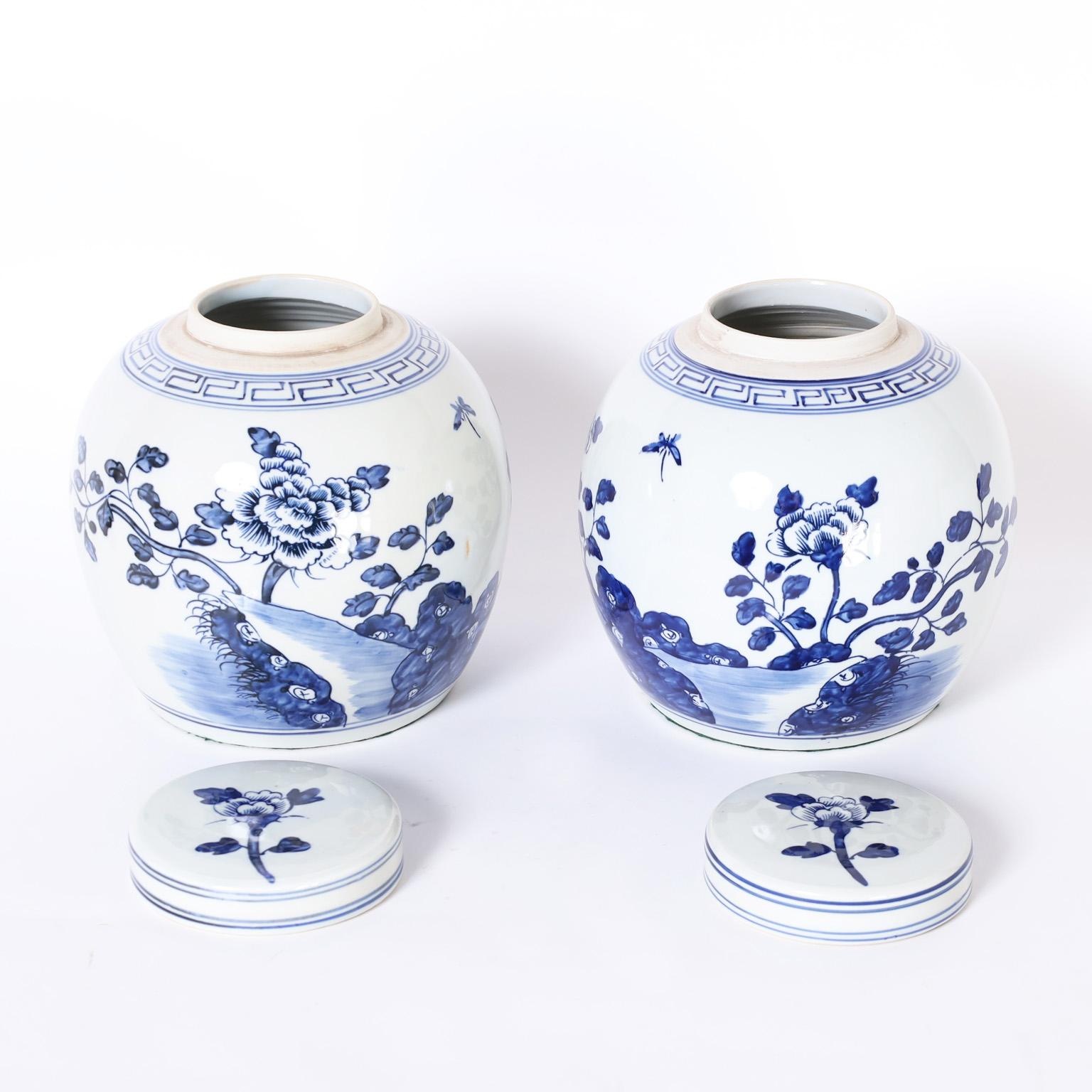 Chinese Pair of Blue and White Porcelain Lidded Jars with Flowers