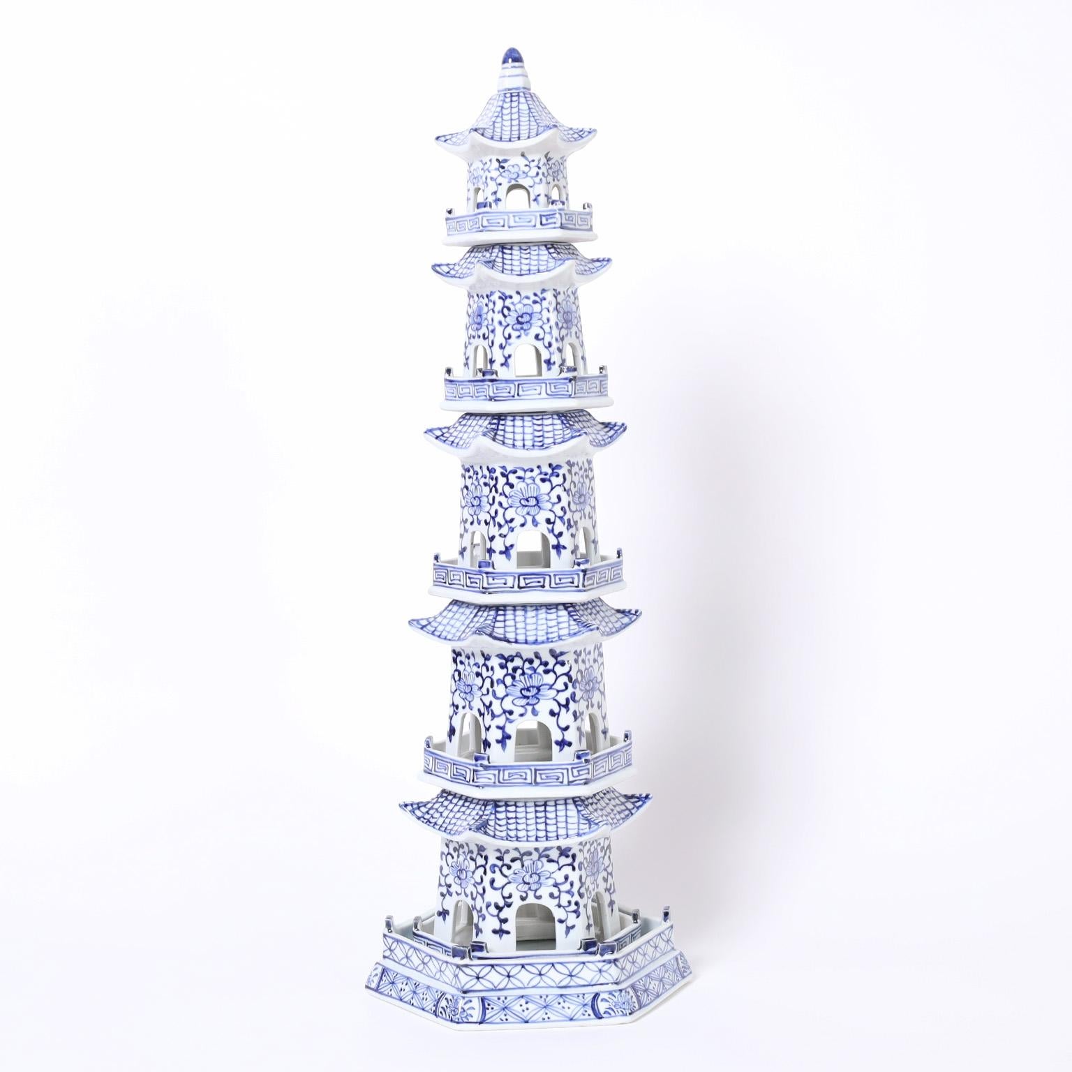 Impressive pair of architecturally dramatic Chinese blue and white porcelain pagoda towers each crafted with six hand decorated separate pieces.