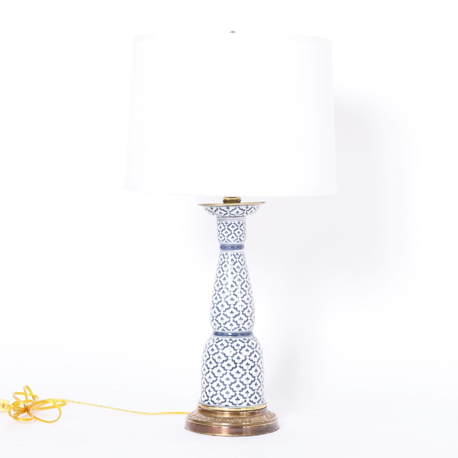 Asian modern pair of table lamps handcrafted in porcelain and decorated with blue and white over a classic chinoiserie form. Signed Maitland-Smith on the bottoms.