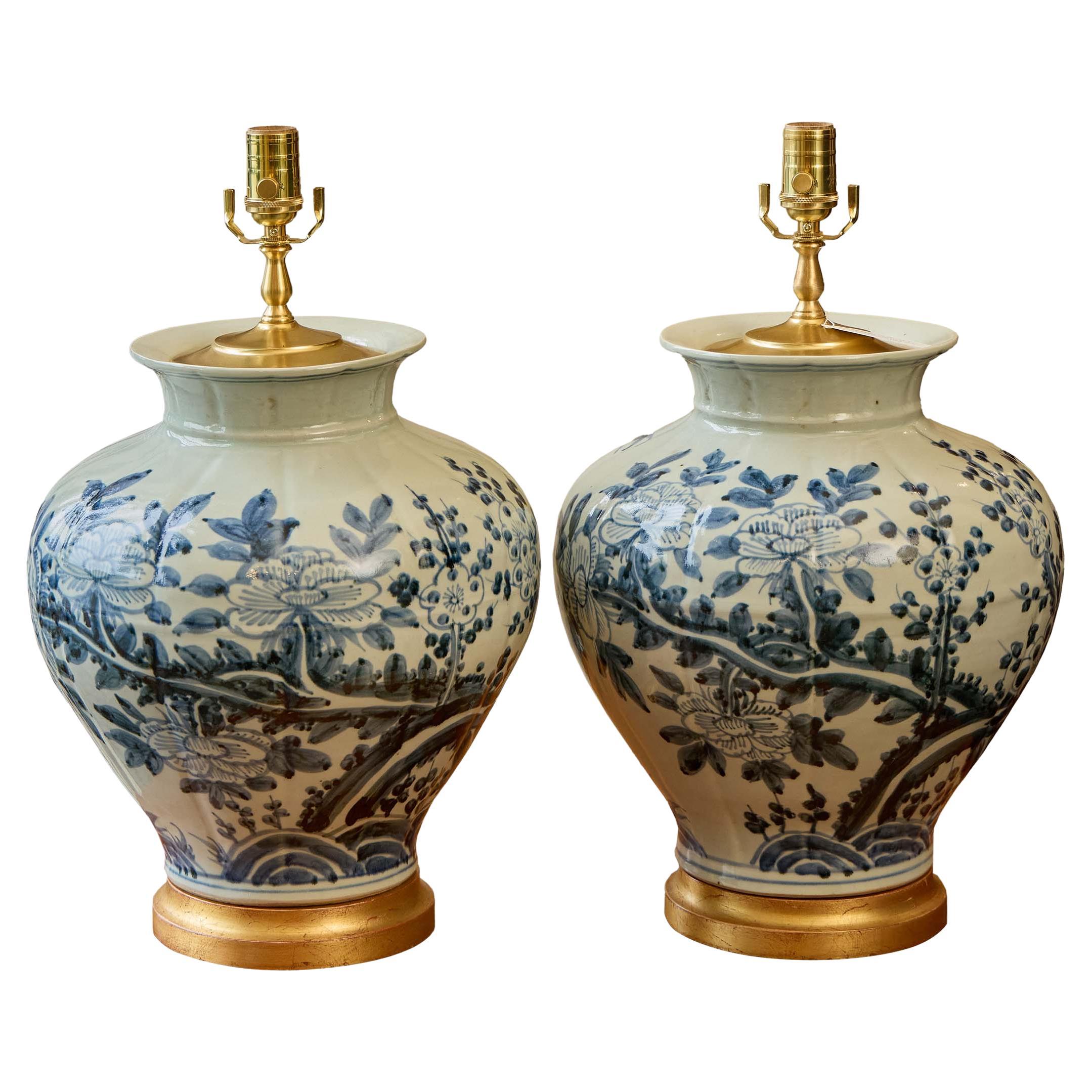 Pair of Blue and White Porcelain Vase Lamps with Floral Brushwork and Gilt Bases