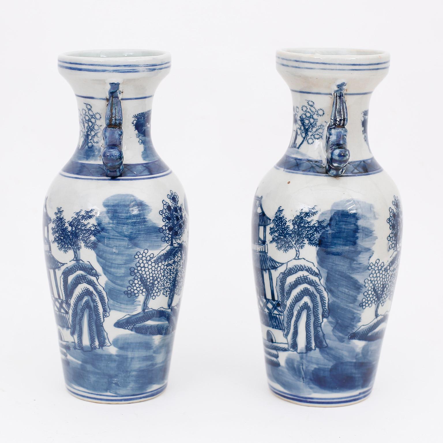 Pair of Chinese blue and white porcelain vases with Classic form and decorated with pagodas and landscapes, in the Chinese Export manner.
