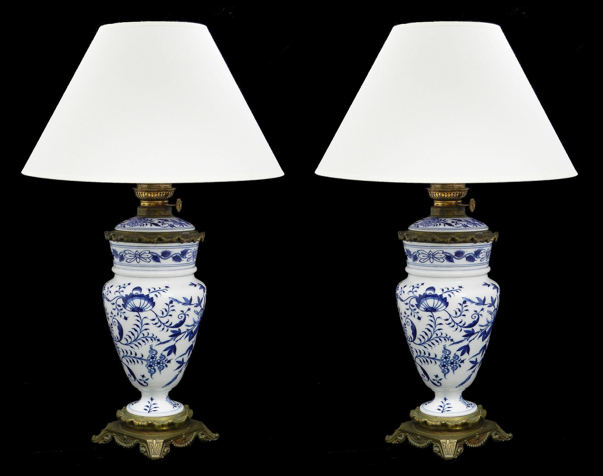 Pair of antique blue and white oil lamps converted to electricity, circa 1900-1910
Chinoiserie floral porcelain
with gilt metal mounts and retaining the characterful oil lamp fittings
Good antique condition sound and solid with minor signs of