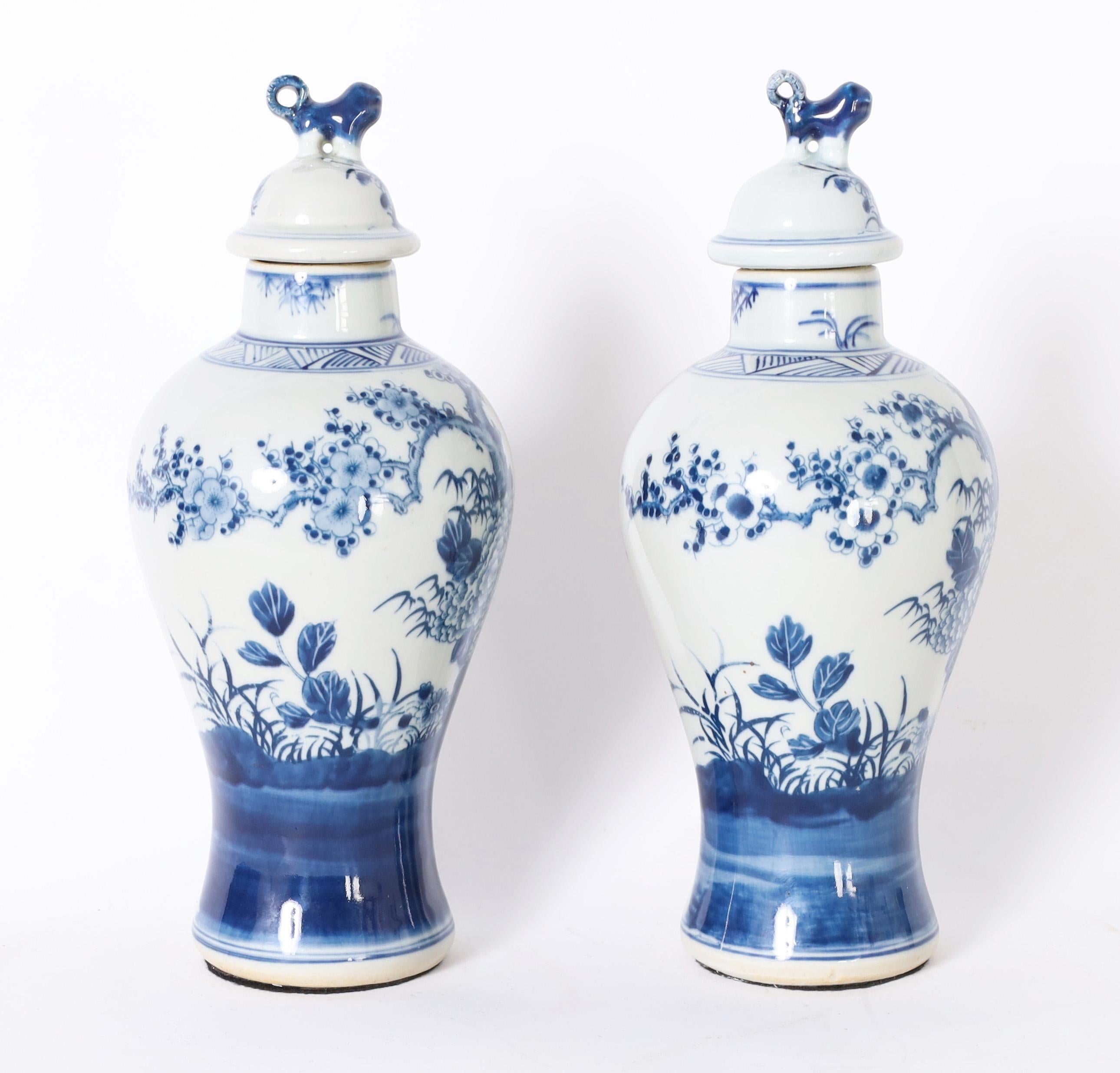 Chinese Export Pair of Blue and White Urns or Jars With Flowers For Sale