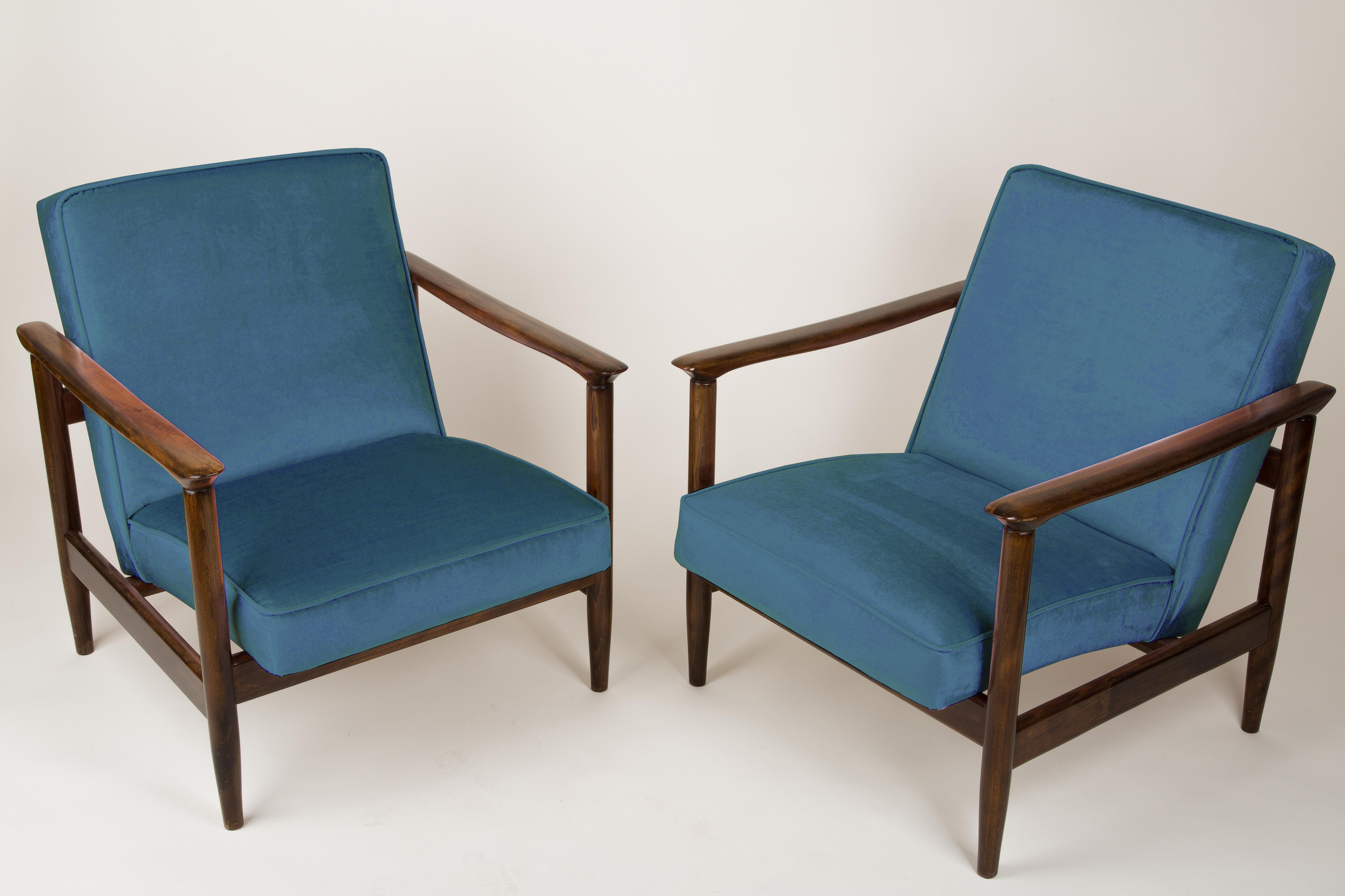 A pair of armchairs GFM-142, designed by Edmund Homa. The armchairs were made in the 1960s in the Goscieninska Furniture factory. They are made from solid beechwood. The GFM-142 armchair is regarded one of the best polish armchair design from the