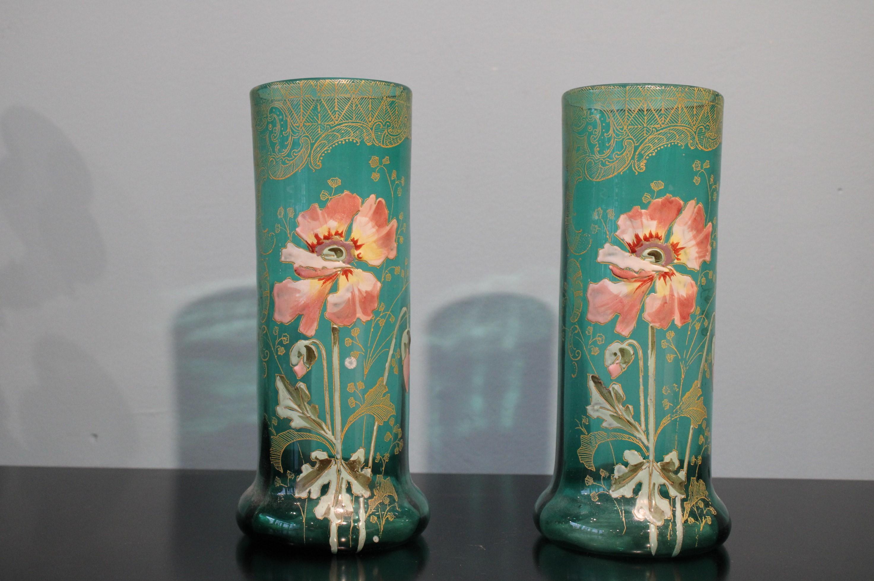 Pair of blue glass vases, Art Nouveau style.
Circa 1900
Enamelled and gilded decor.