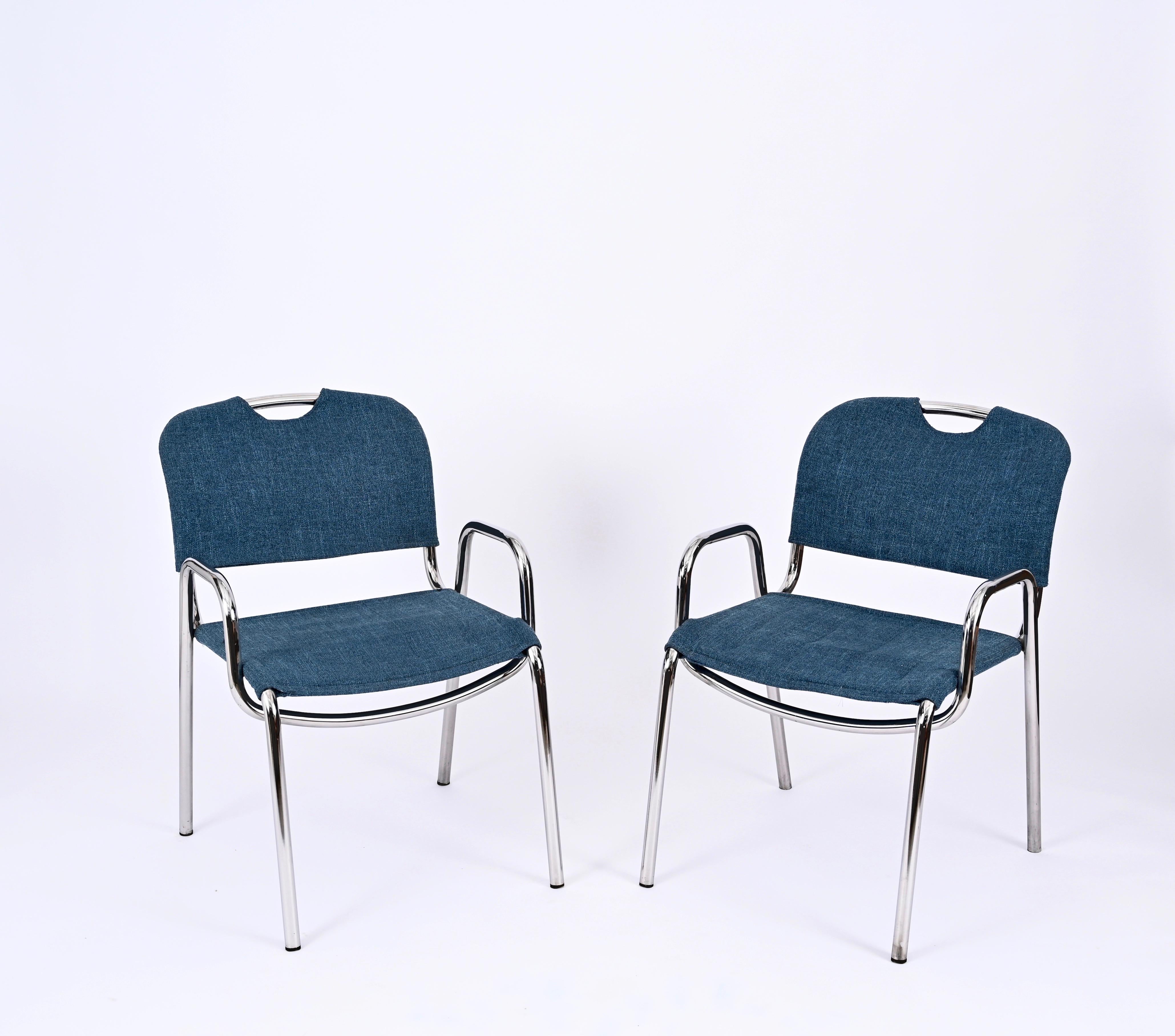 Lovely pair of stackable Castiglietta Chairs in blue fabric. These iconic chairs were designed by Achille Castglioni and produced by Zanotta in Italy in the 1960s, the chairs are signed on the bottom of the legs. 

The Castiglietta chairs are made