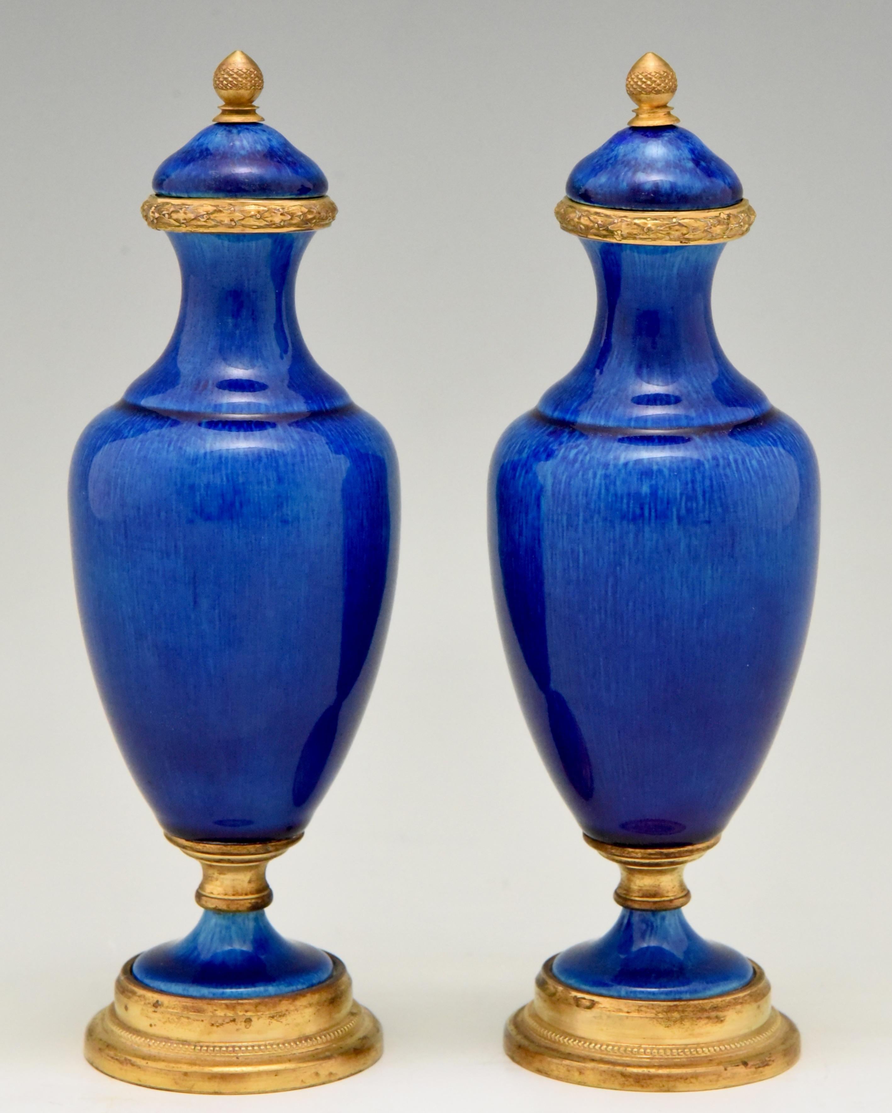 Pair of classical vases or urns with beautiful blue glaze.
The vases are have bronze details and are marked P.M. Sevres.
France, circa 1900. Hard to find in this size.
Measures: H 20 cm x L 7 cm. x W 7 cm.
H 7.9 inch x L 2.8 inch. x W 2.8