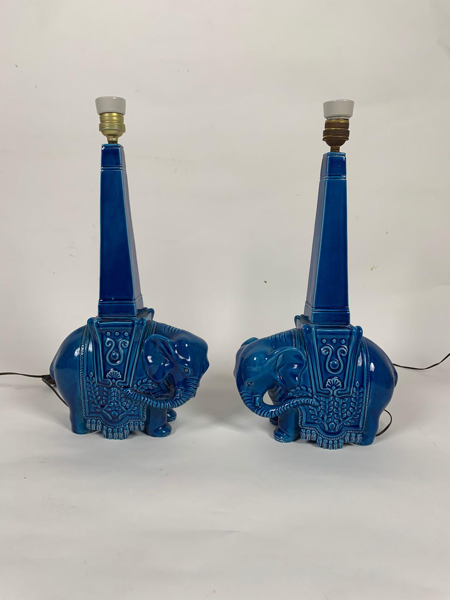 Pair of blue ceramic table lamps representing elephants, Italy, 1960s

Pair of ceramic lamps of Italian manufacture from the 1960s depicting two elephants. 
Very good condition of the ceramic bases.

Measurements 120 x 100 x 20h cm 