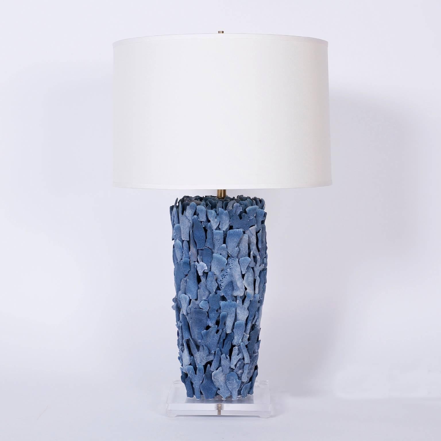 Exclusive pair of blue coral table lamps designed and executed by F.S. Henemader
expertly crafted with a rare alluring indigo colored coral and presented on Lucite bases.