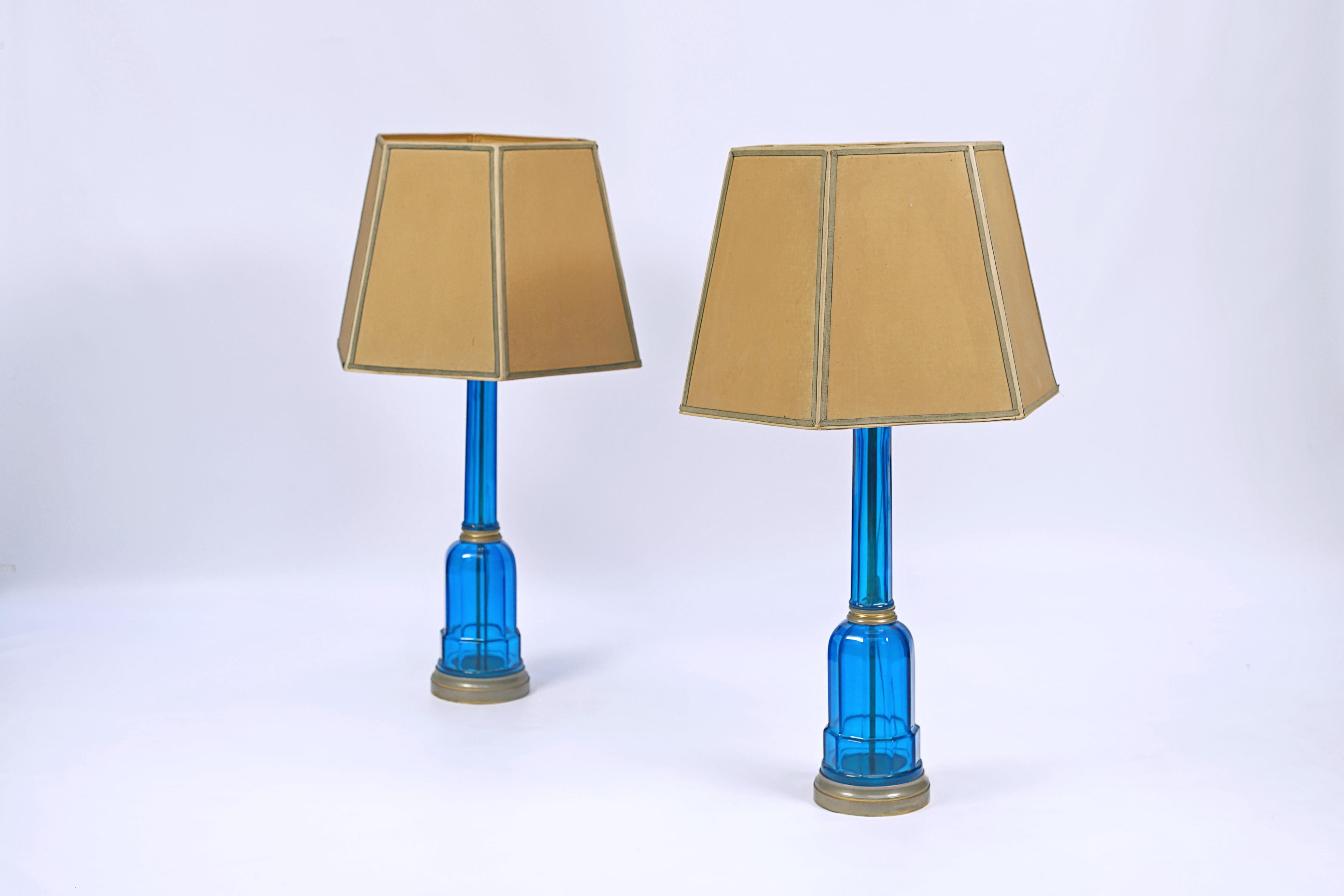 Pair of blue crystal lamps. Hexagonal shape and details in bronze.

Europe, circa 1930.