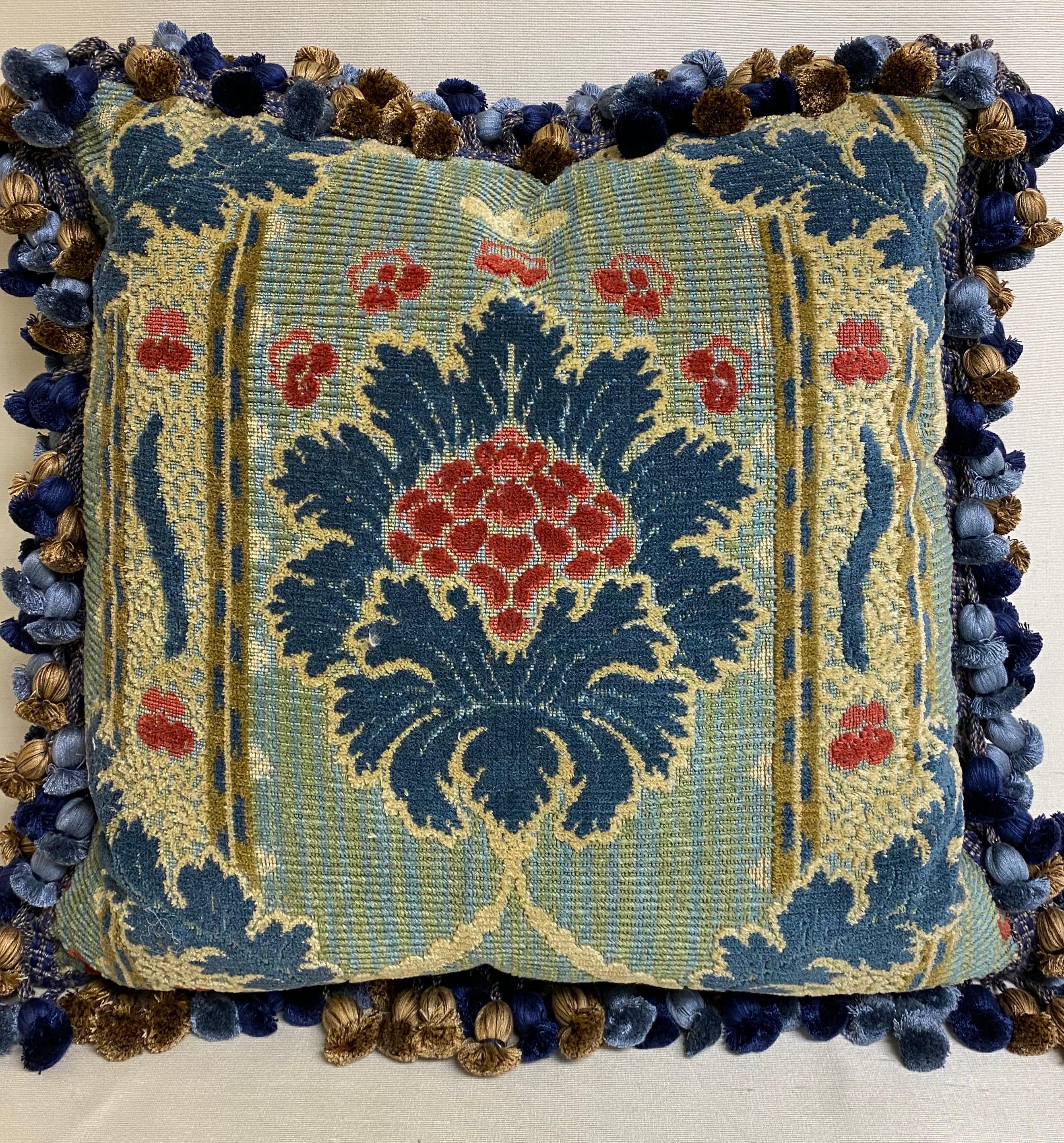 Very decorative pair of down-filled blue floral cushions with red and cream accents and 