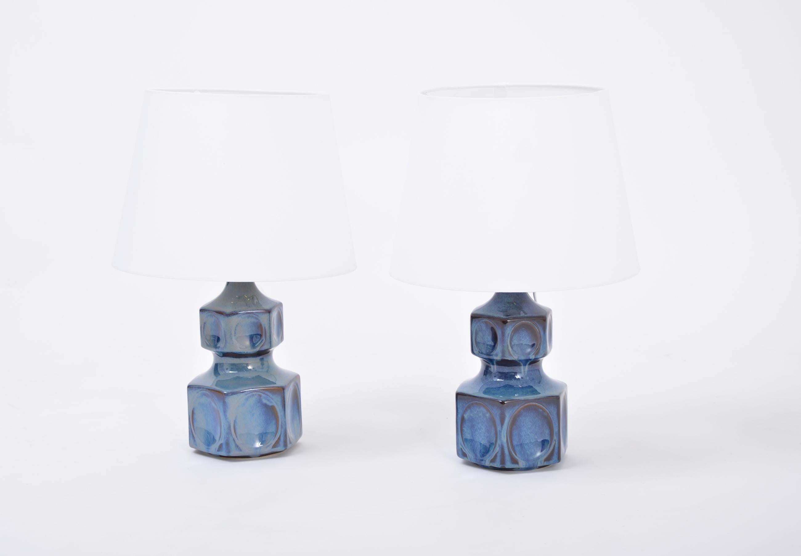 Pair of blue Danish midcentury table lamps by Einar Johansen for Soholm
Pair of sculptural table lamps model 1062 designed by Einar Johansen and produced by Danish company Soholm most probably in the 1960s. The lamps are made of stoneware with blue