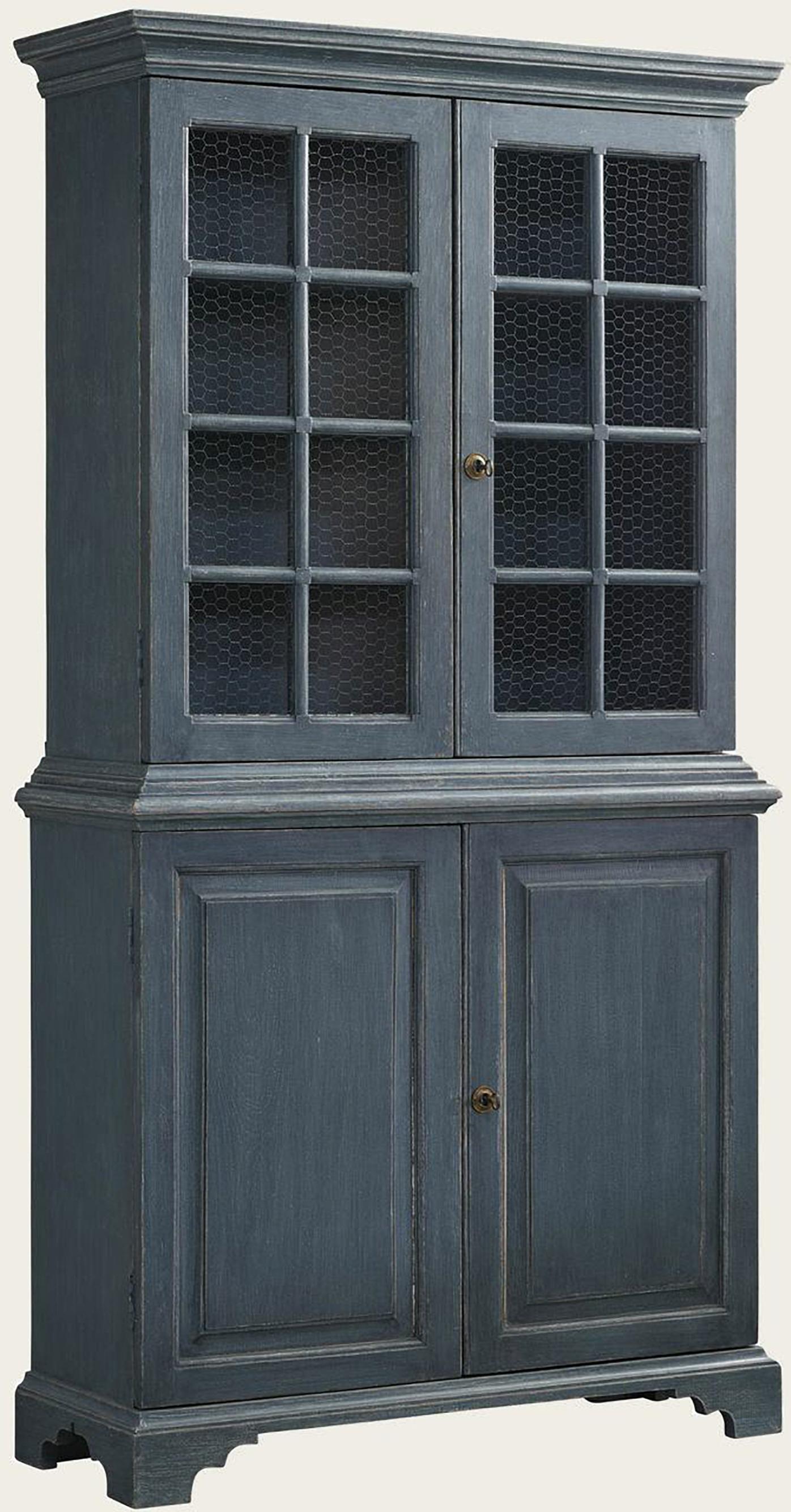 Beautiful pair of blue painted, Gustavian style Bookcases with charming chicken wire in the cabinet doors. The distressed patina has been expertly done and gives an unparalleled warmth. These hand-painted and hand-carved bookcases are wonderful