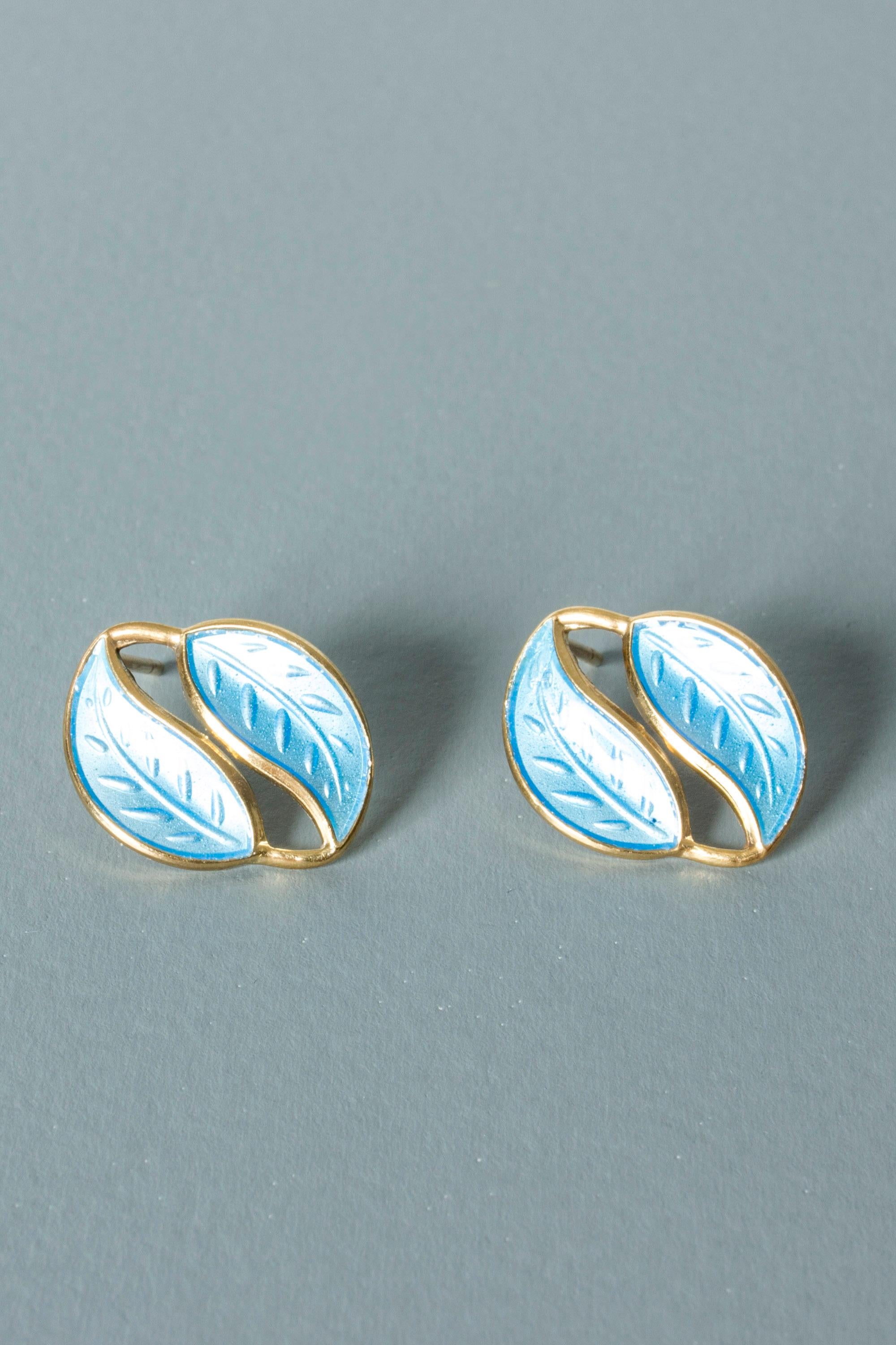 Pair of lovely silver earrings from David Andersen. Gilded with luminous blue enamel on the little leaves. Beautiful combination of materials.