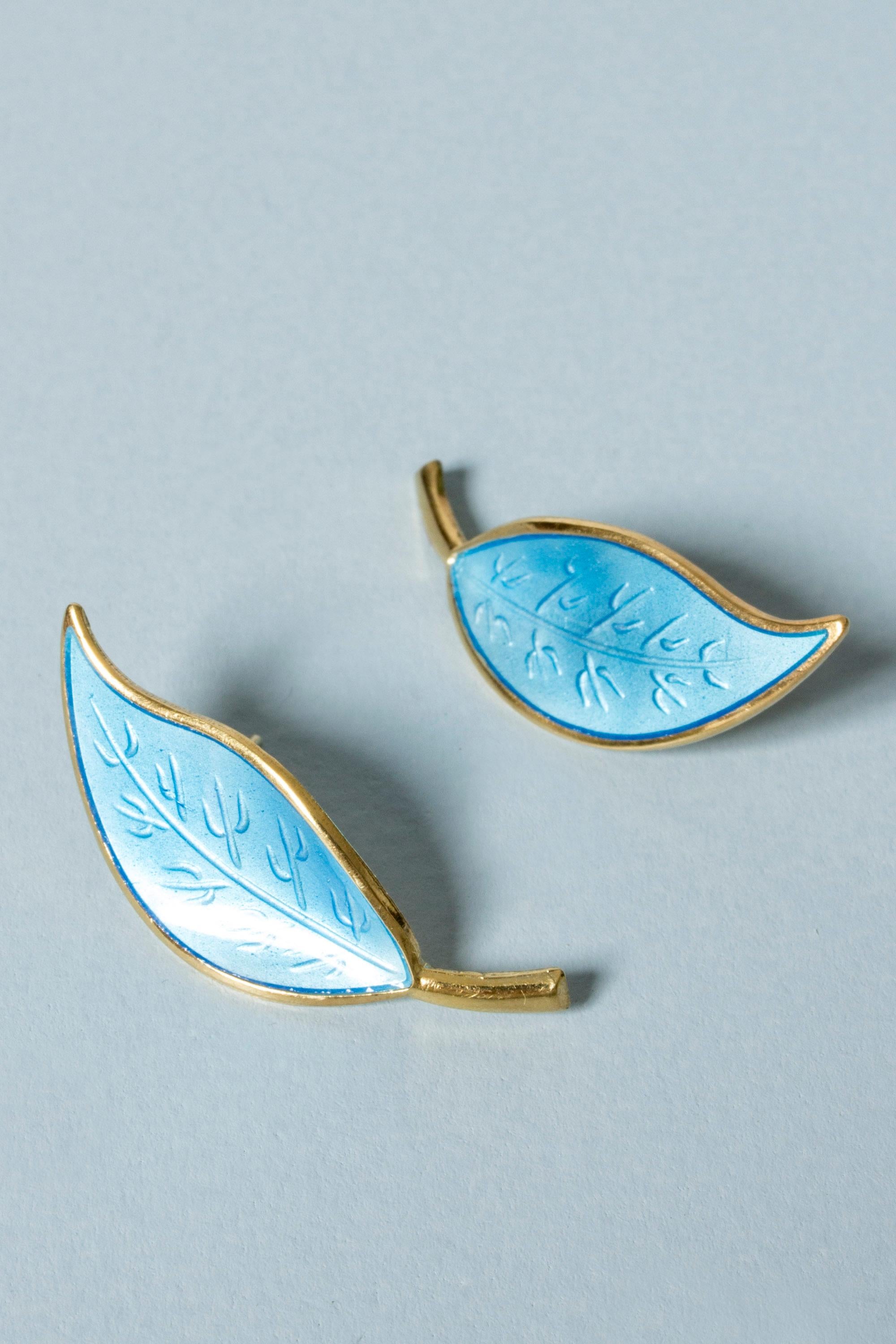 Pair of beautiful silver earrings from David Andersen in the form of leaves. Designed with vibrant blue enamel against the gilded silver.