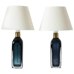 Pair of blue glass table lamps by Carl Fagerlund for Orrefors, Sweden.