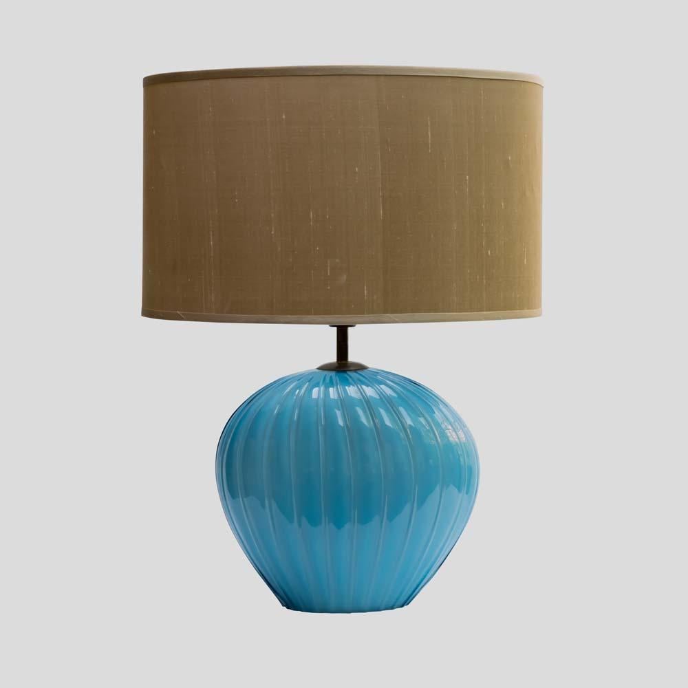 Pair of  early 1960s table lamps. Italian design by Tommaso Barbi for Barovier and Toso Murano Italy. Hand blown worked ribbed sky blue glass  with brass metal lamp holder.

Lamp base 30 x 20 x  38 cm (h)
Shade used ( 45 cm 28 x 28cm h )
Lamps are