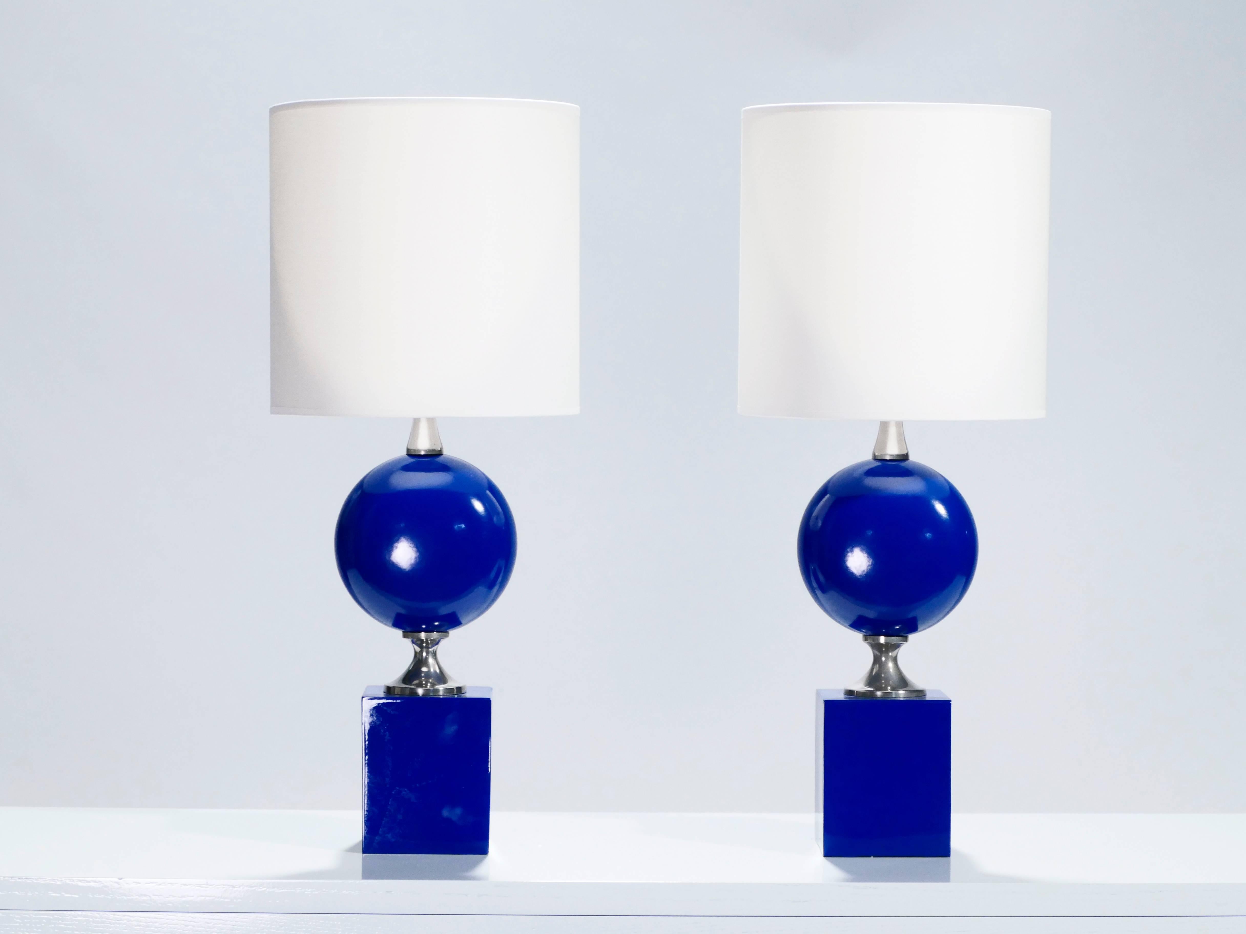 Electric blue is not a color you come across often in bedside lamps. This Mid-Century Modern pair was designed by French lighting artist Philippe Barbier in the 1970s and with its bulbous midsection topping a thick square base, is typical of his