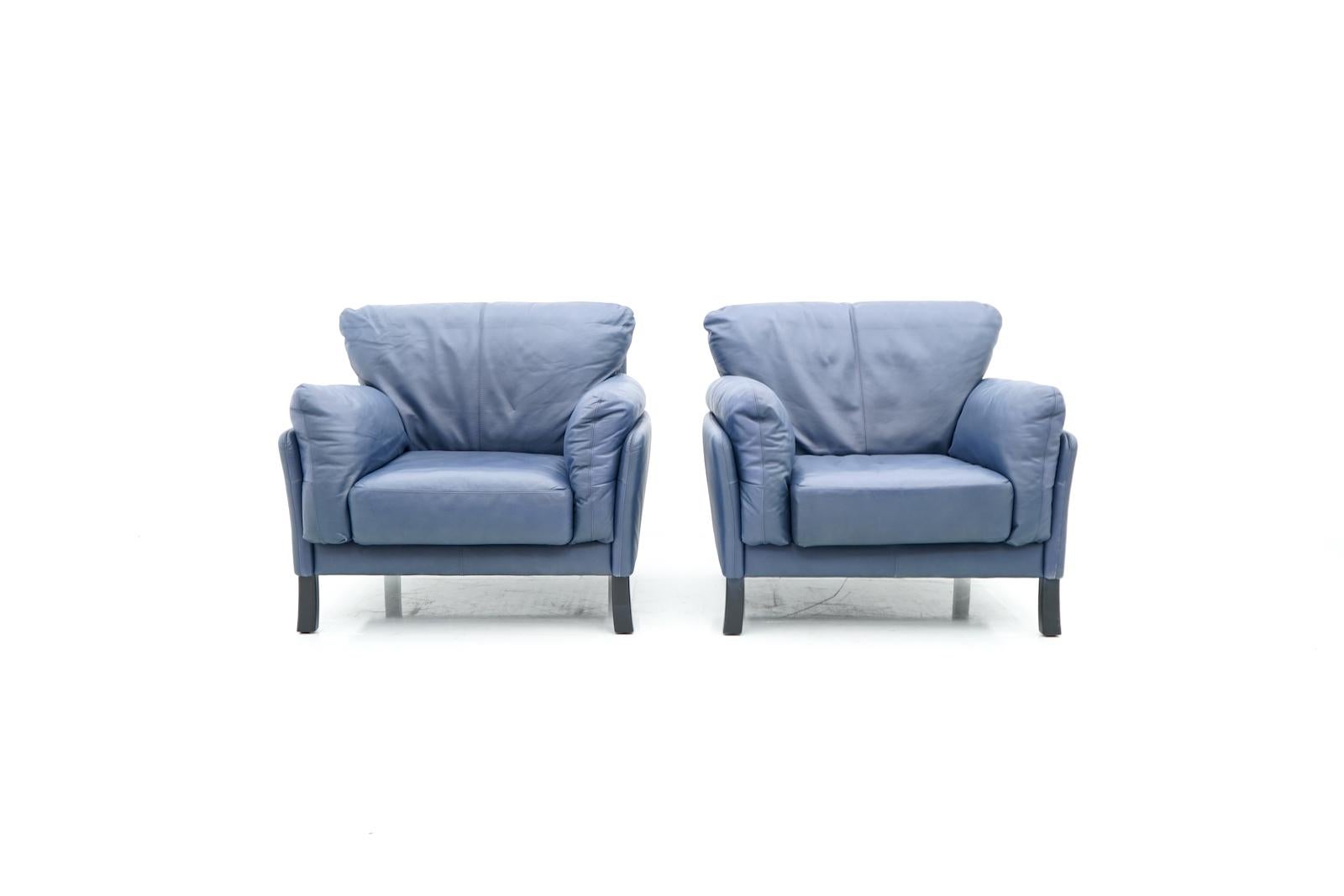 Pair of ultra comfortable lounge chairs by Dreipunkt International in blue leather and black wood legs. Very good condition


We also have the matching three seat sofa in stock.