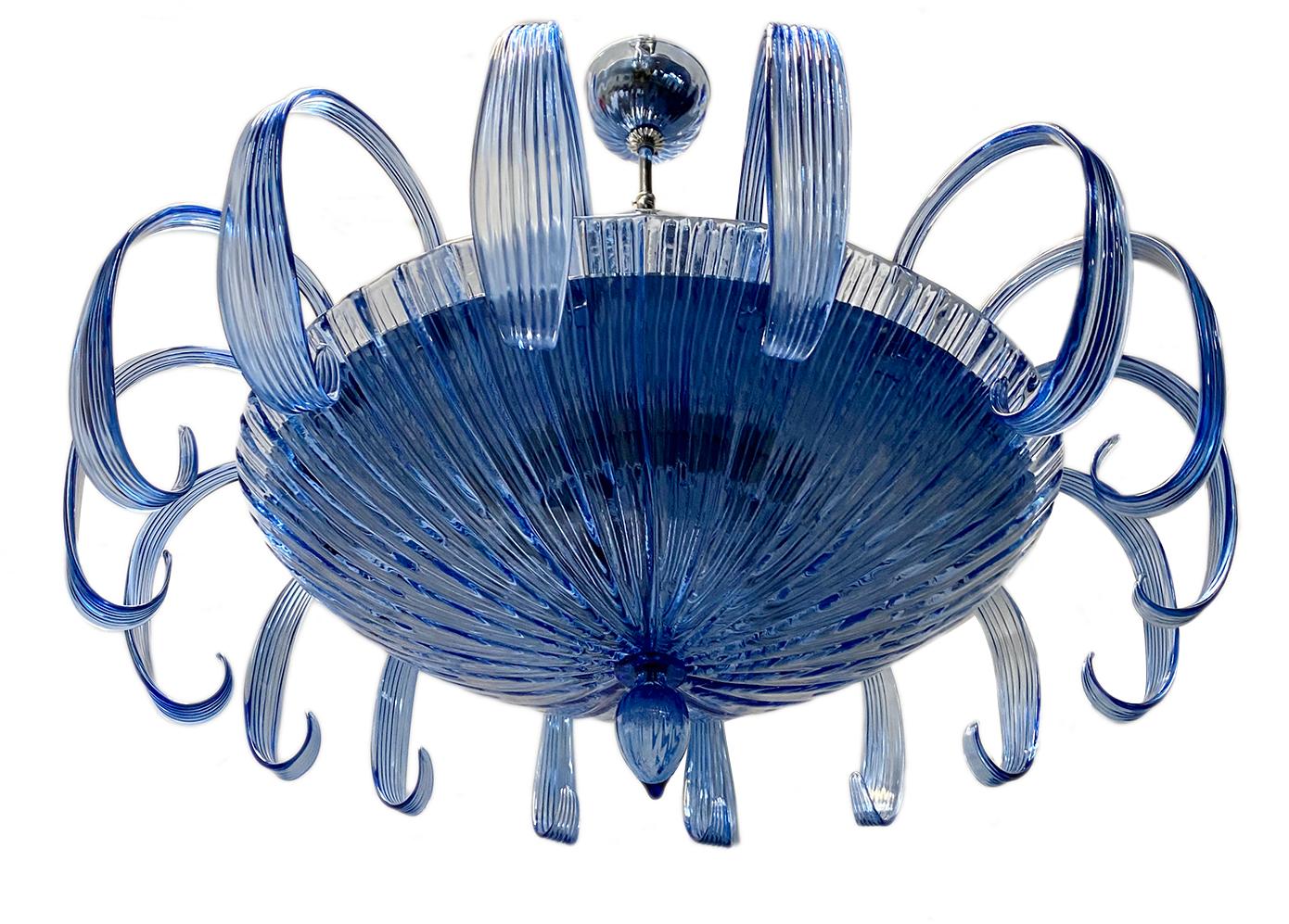 A pair of circa 1950's hand blown blue Murano glass chandeliers with interior lights. Sold individually.

Measurements:
Diameter: 33