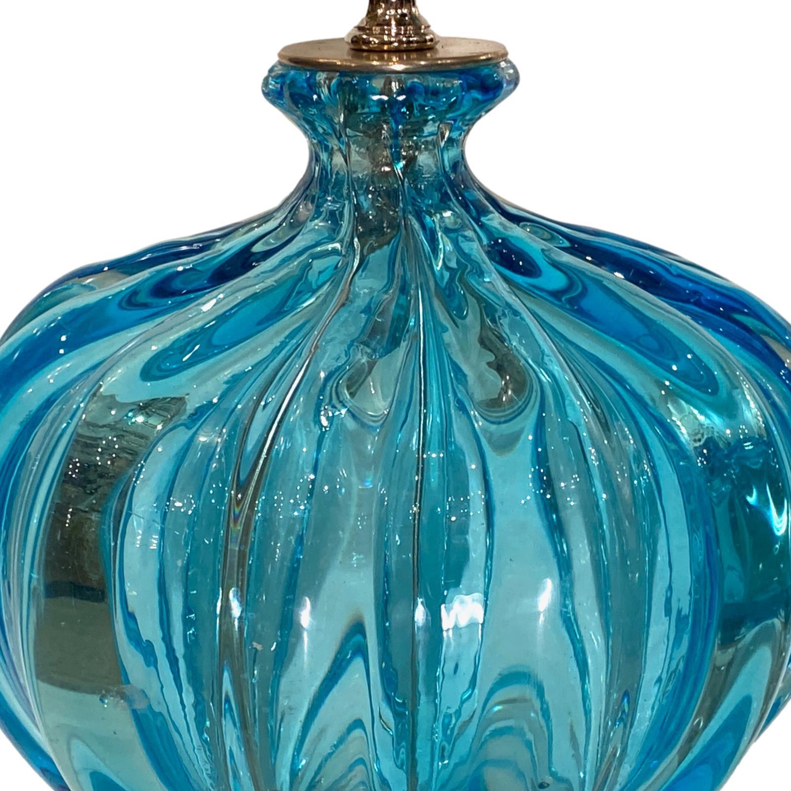 A pair of circa 1930's blue glass Murano lamps with etched glass and nickel-plated bases.

Measurements:
Height of body: 14