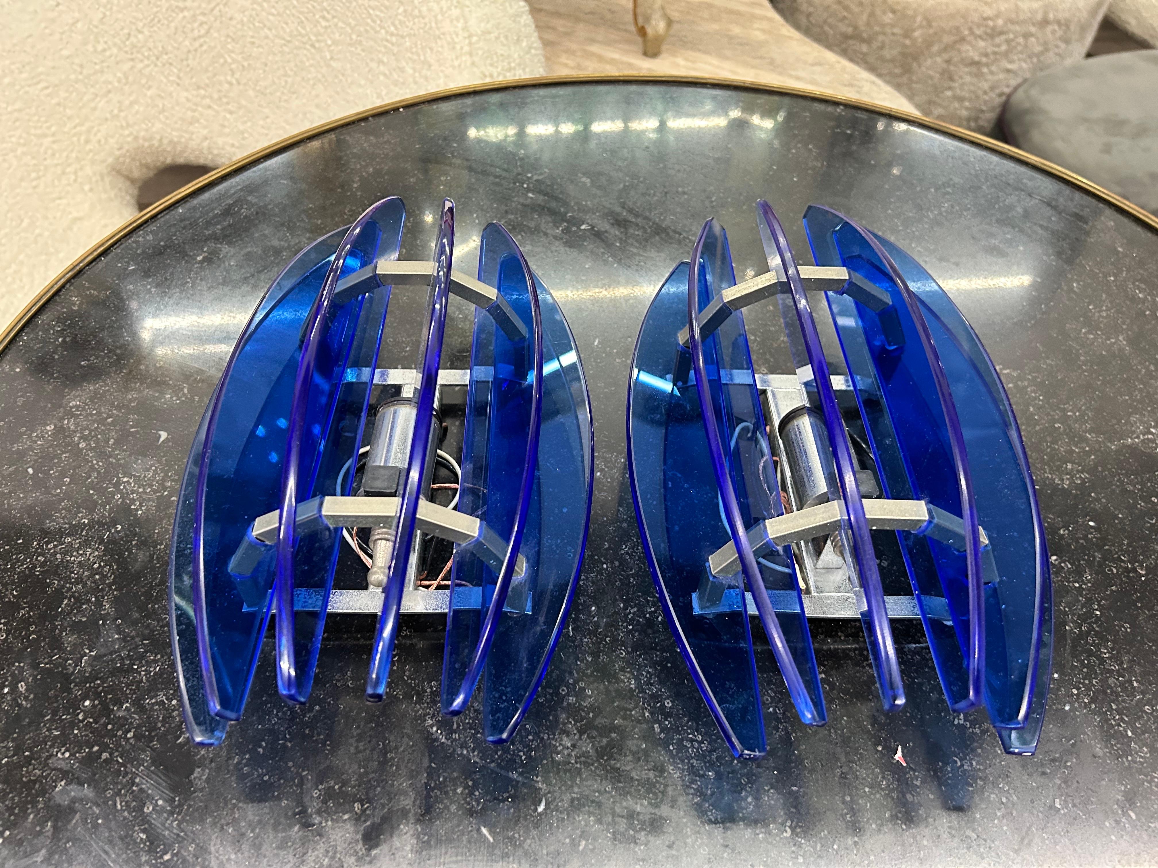 Pair of Blue Murano Glass Sconces by Veca.
This lovely pair of Italian sconces have cobalt blue glass panels mounted on chromed steel frames.
Each sconce has been newly wired with new sockets for the U.S. market.
Italian modern lighting at it's