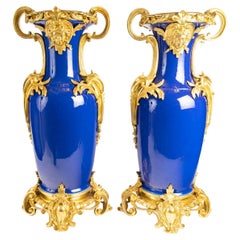Pair of Blue Porcelain and Gilt Bronze Vases, Regency Style, 20th Century.
