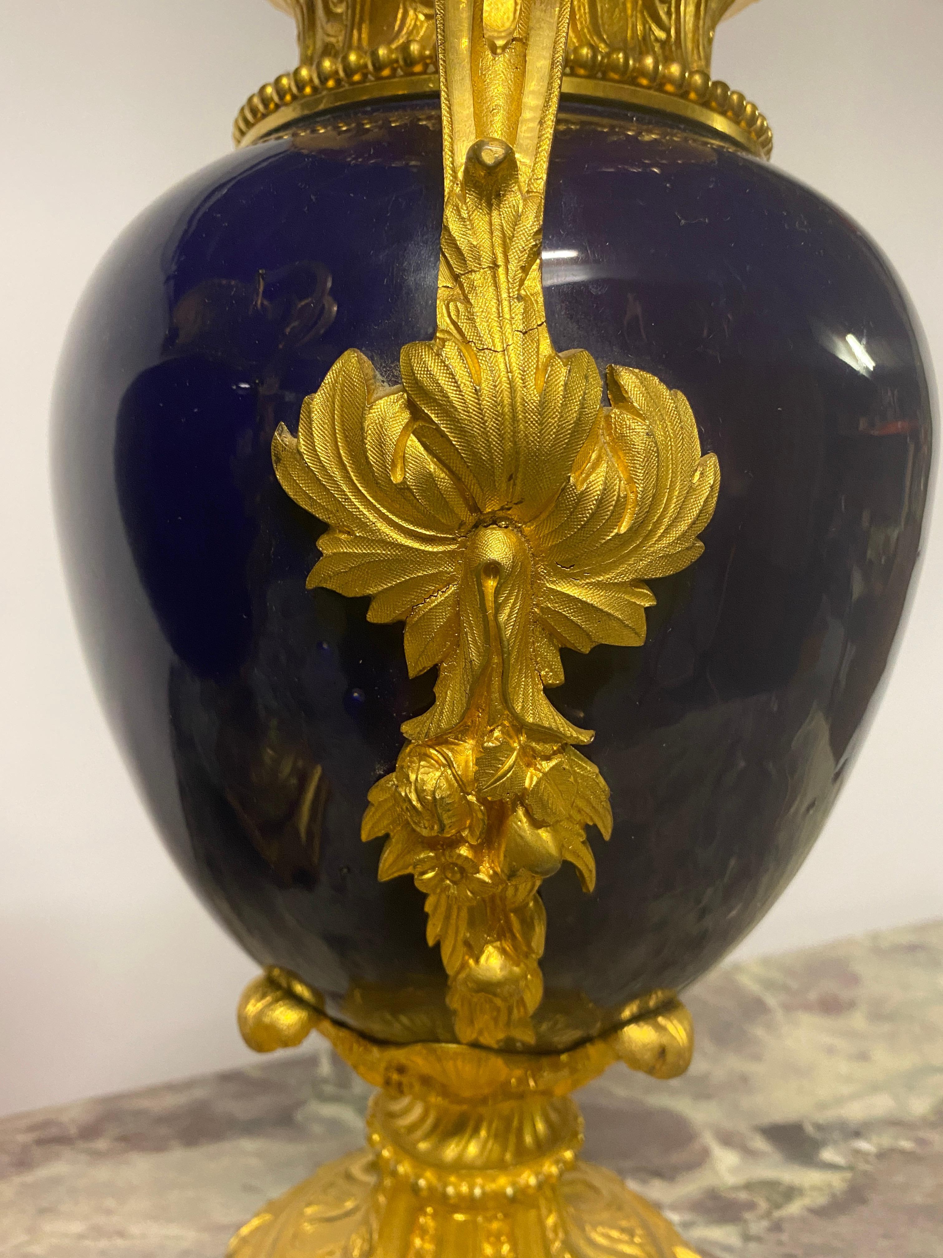 Louis XVI Pair of Blue Porcelain Vases from the Late 19th Century, with Gilt Bronze Mounts For Sale