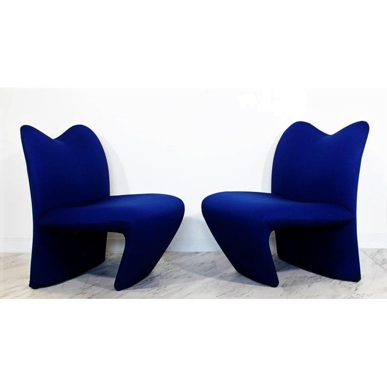 Spectacular from every angle, pair of sculpted side lounge chairs in the style of Pierre Paulin. The chairs are made from a wooden frame with blue upholstery. Fully upholstered with simple lines and just the right amount of detail.