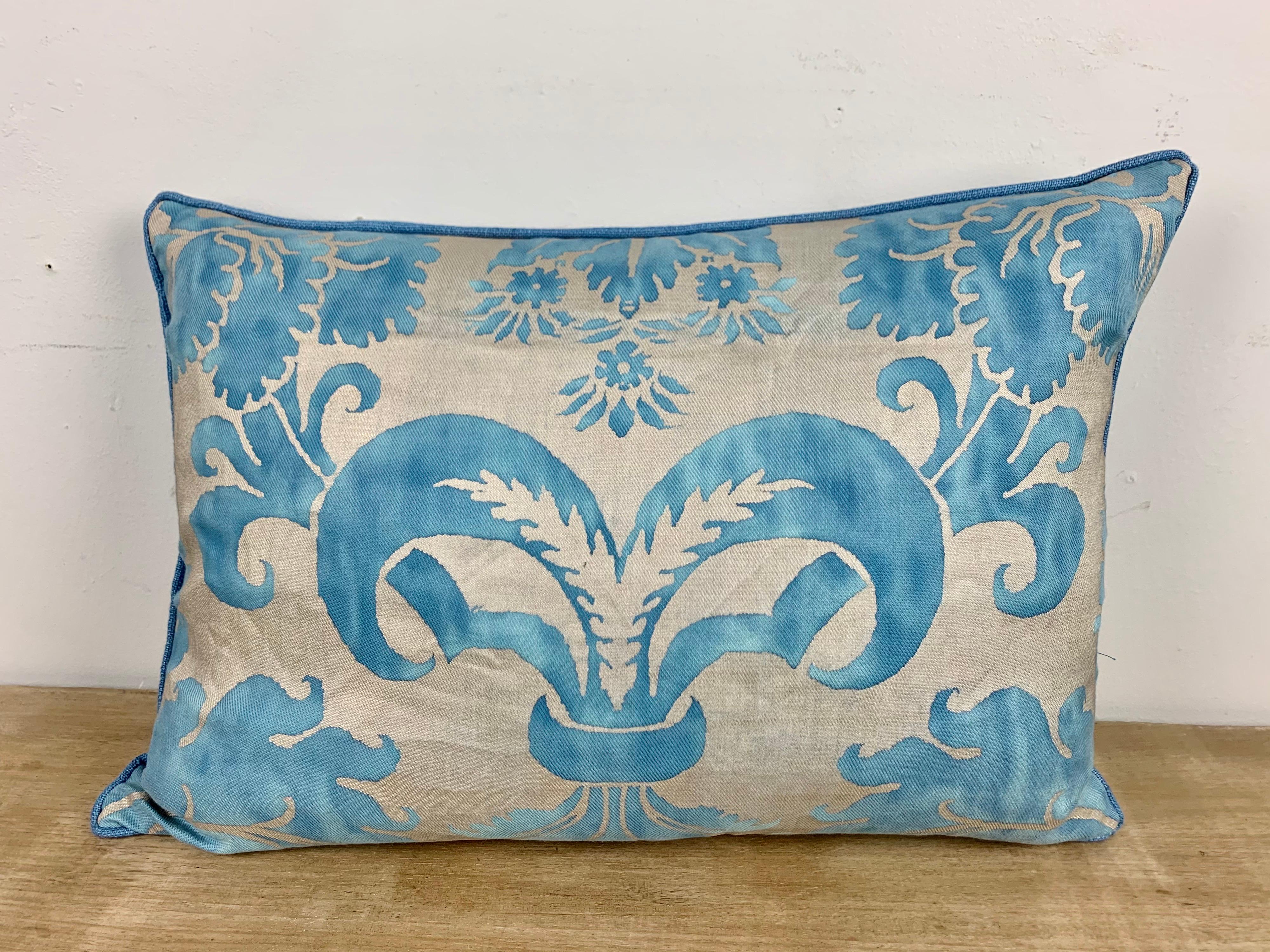 Pair of blue and silver Glicine patterned Fortuny textile pillows with blue linen backs and self cord detail. Down filled inserts, sewn closed.
