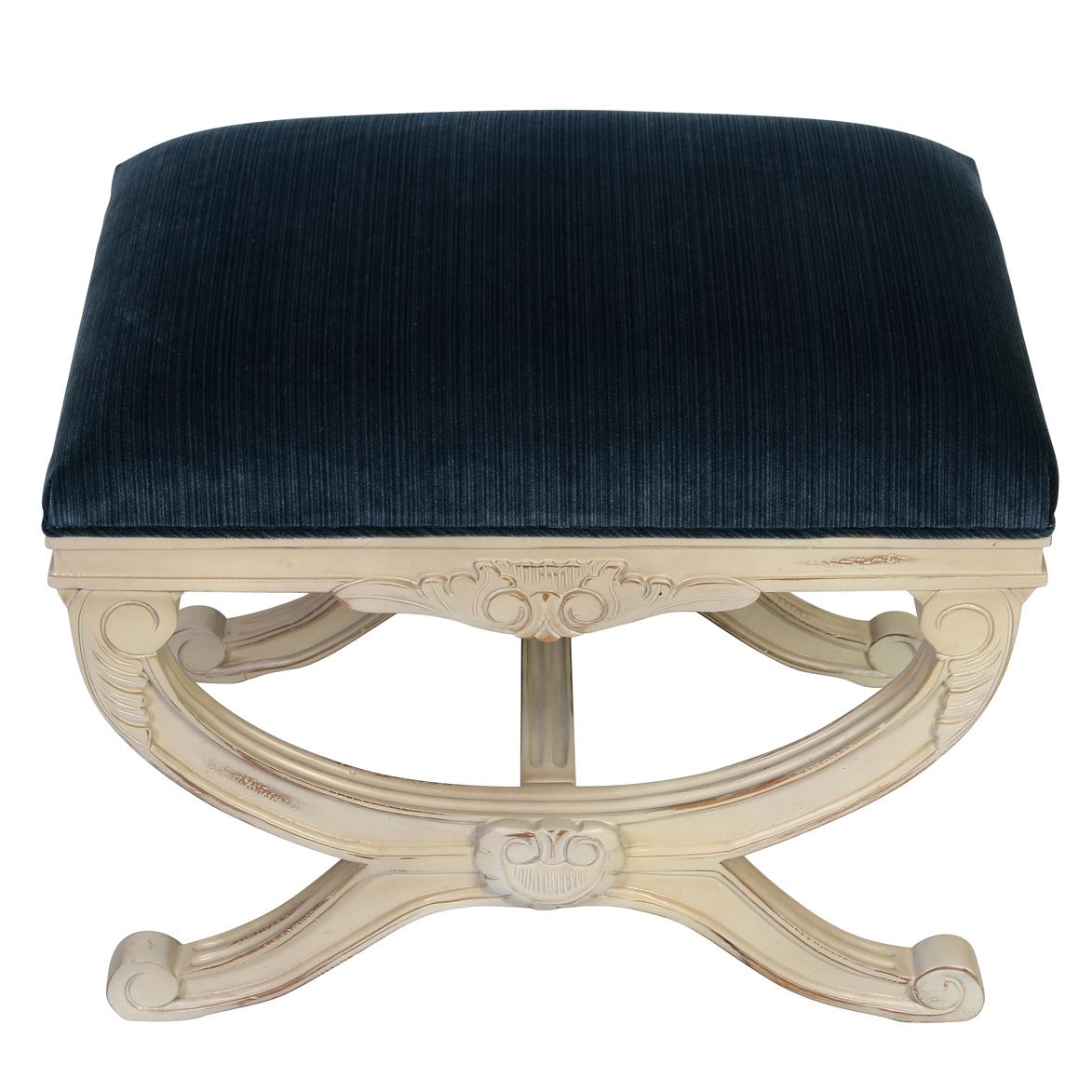 A pair of newly reupholstred blue strie velvet Regency style curule shape stools crafted with detail. These stools feature a carved and painted X-form base that adds an element of sophistication to any room. The distinctive curule shape, a hallmark