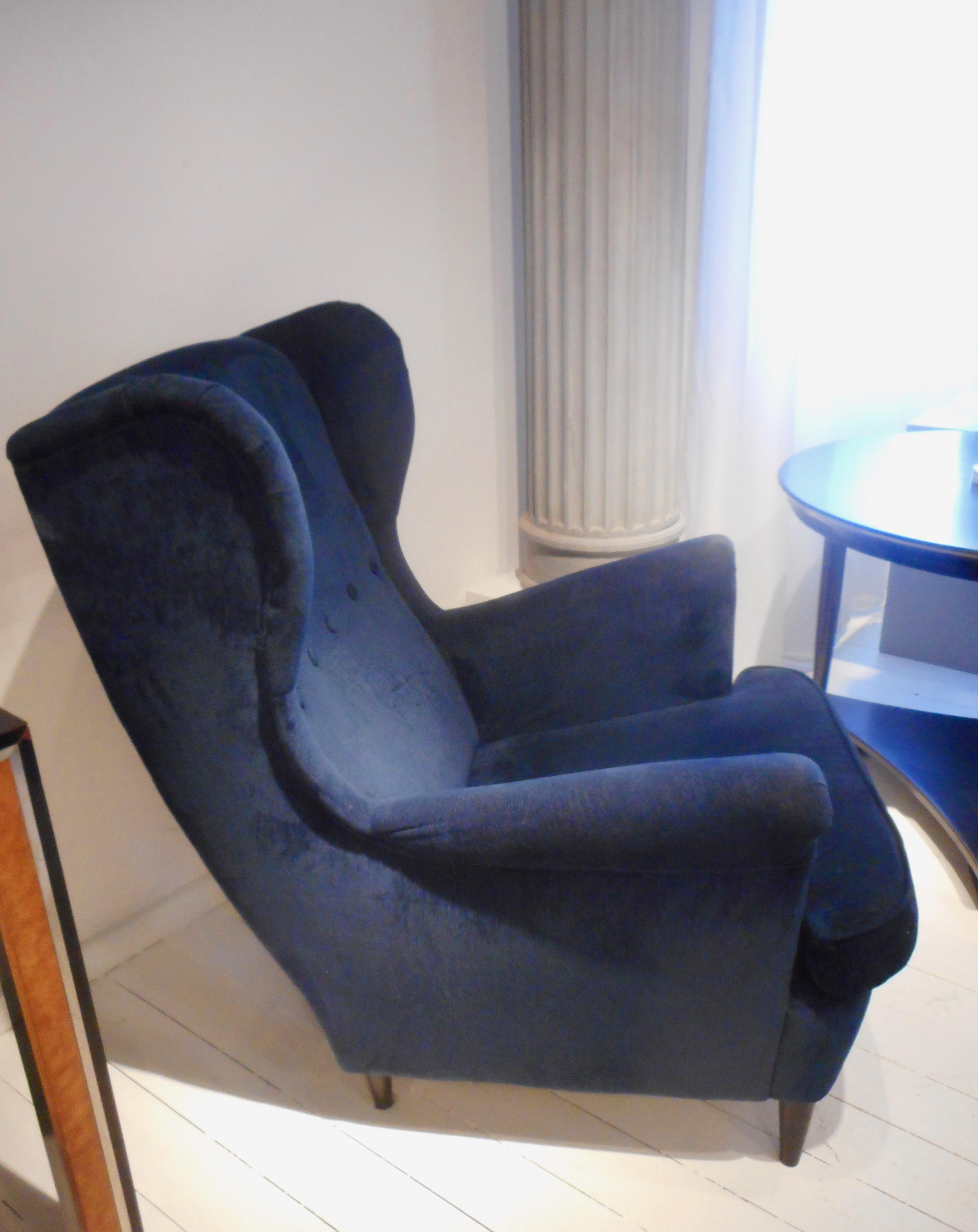 Deep blue velvet high back armchairs probably designed by Gio Ponti, circa 1950 for I.S.A. Bergamo.
   