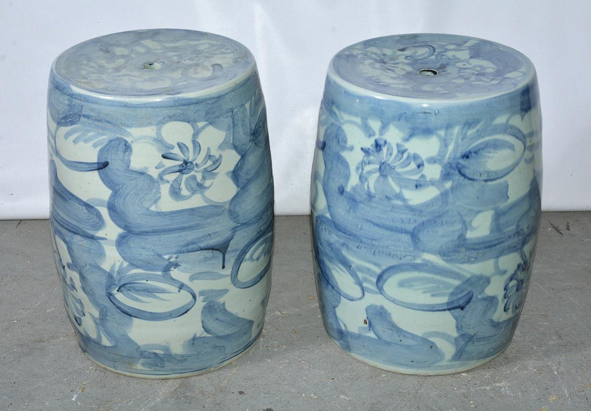 .Chinese blue and white porcelain drum shape garden stools in floral motif. The ceramic stools can be used as plant stand, side table or extra seating. Wonderful in a garden room, porch, or the most elegant living room.