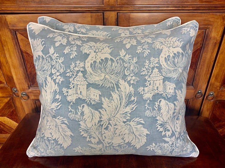 Pair of custom pillows made with vintage blue & white Chinoiserie style patterned fronts and crisp white linen backs. Self cord detail around the perimeter of both pillows. Down filled inserts. Sewn closed.