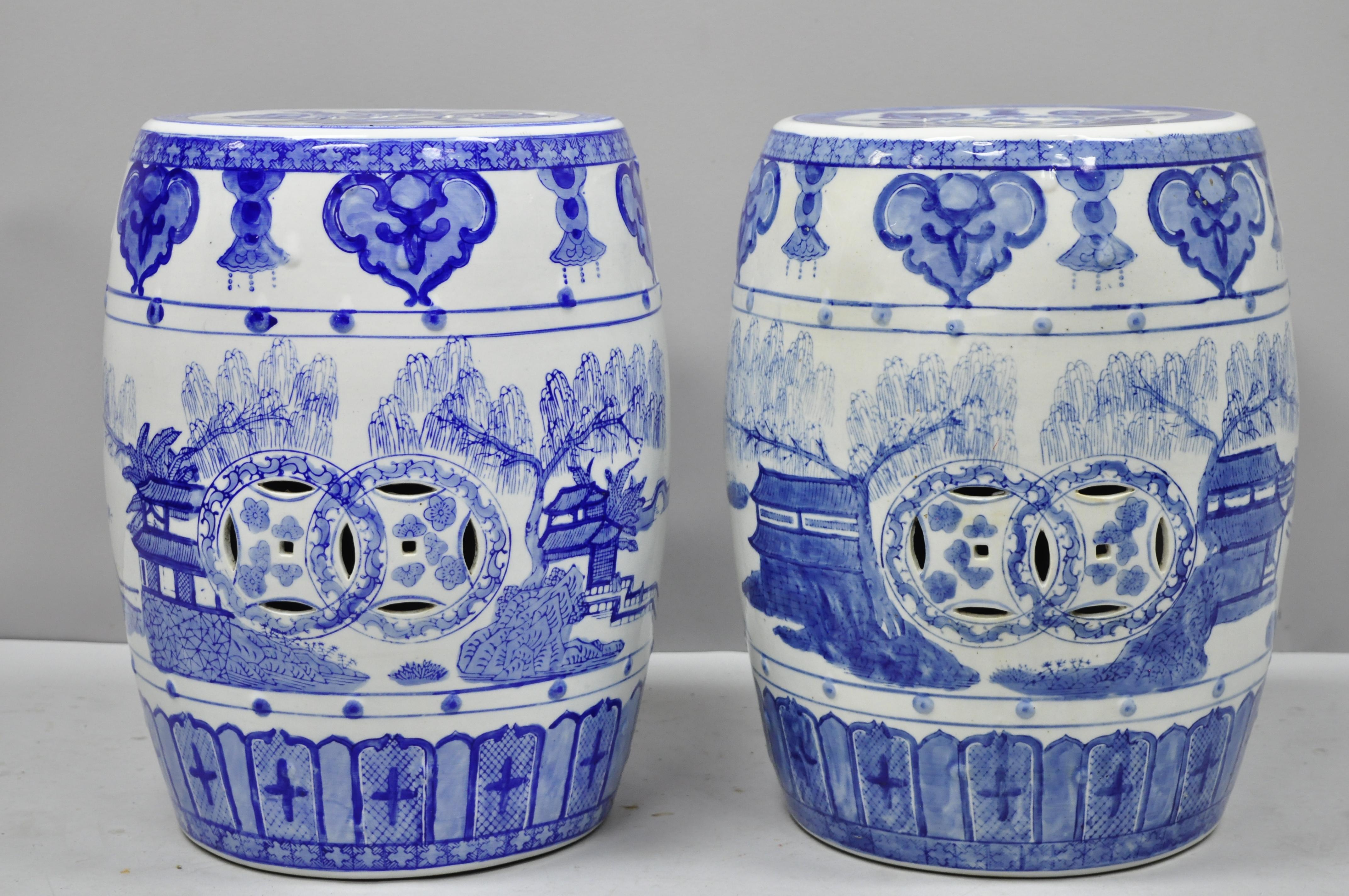 Pair of blue and white pierced porcelain Chinese drum garden seats. Item features porcelain construction, pierced decoration, white and blue paint glazed decoration, great style form. Believed to be 20th century. Measurements: 17