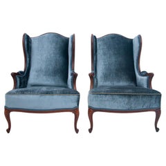 Pair of blue wingback armchairs in Louis Philippe style, France, early 1900. 