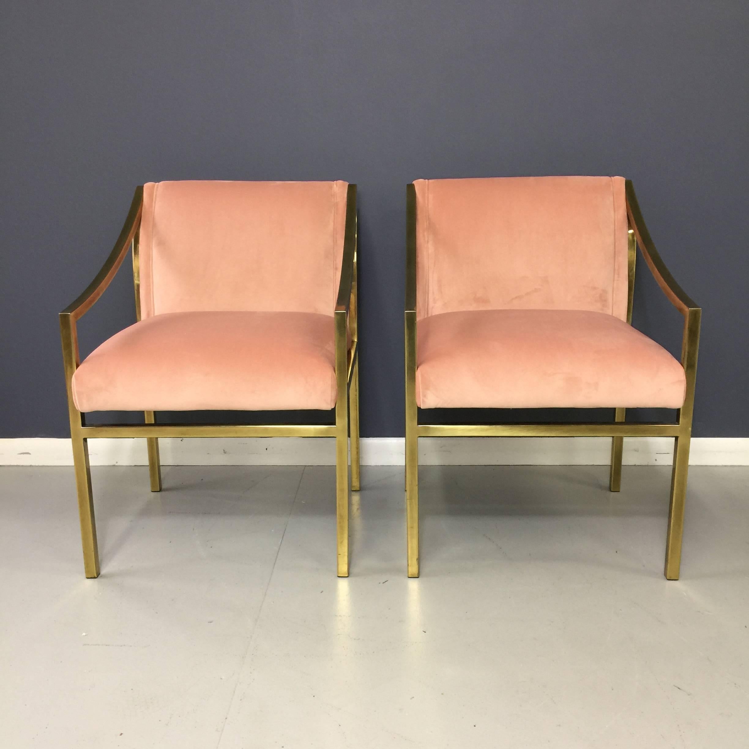 These lovely chairs have been newly upholstered in a lush pink velvet. Brass frames show patina and wear, adding to their charm.