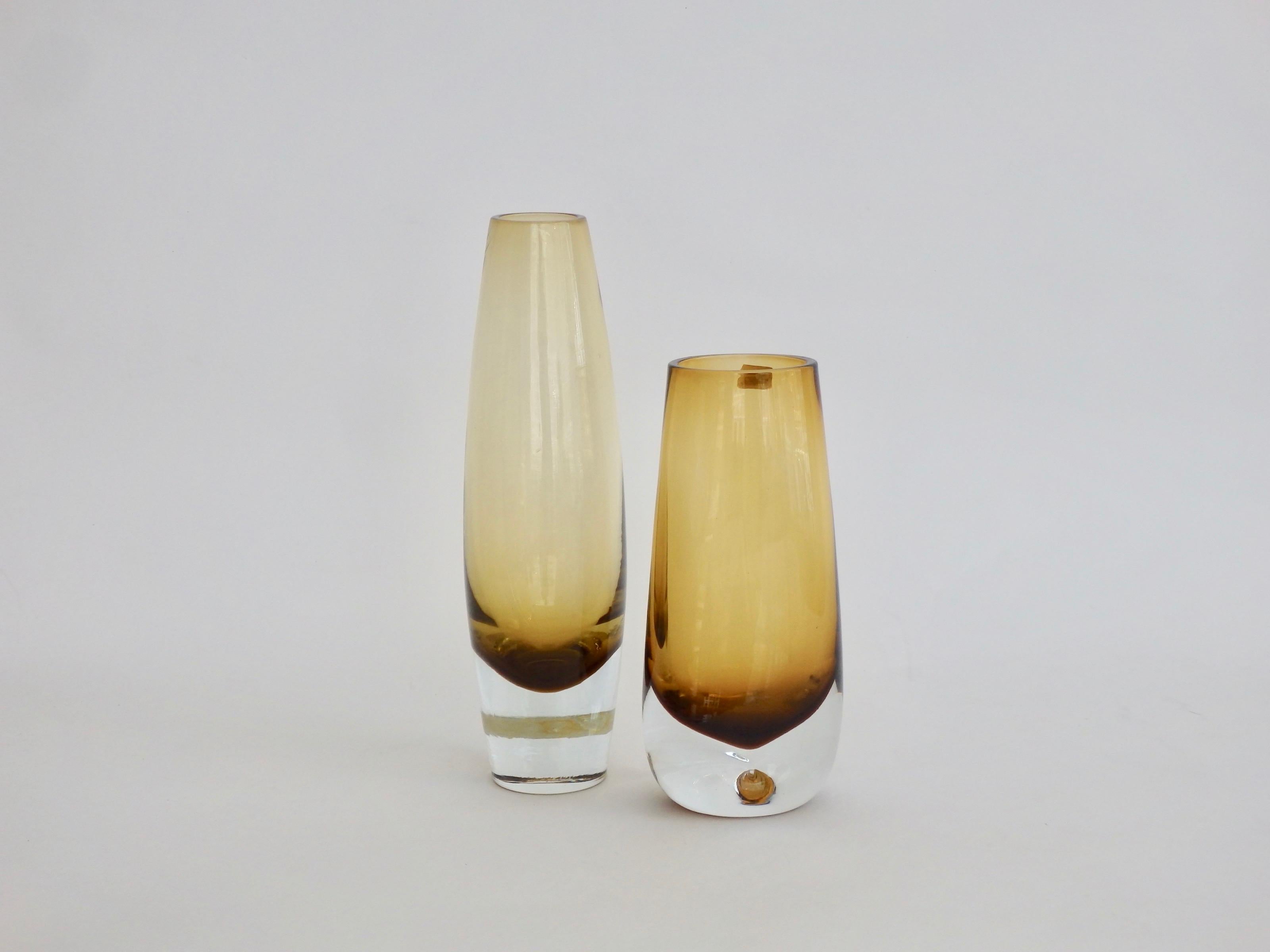 A pair of heavy mouth blown Scandinavian Amber Modern Vases by Bo Borgstrom for Aseda Glasbruk, 1960s. Original labels intact.
Smaller vase measures 7