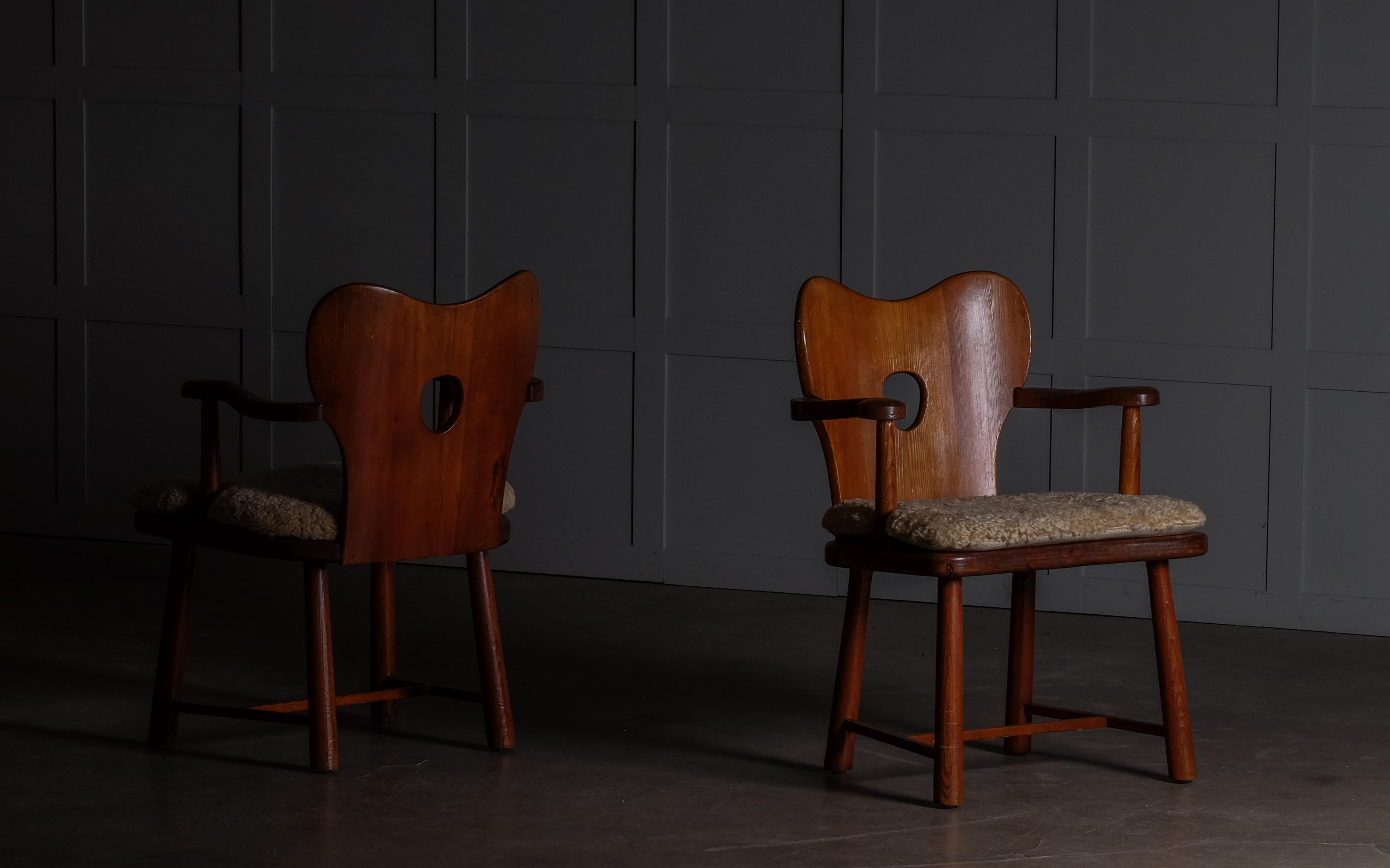 Rare pair of armchairs by Bo Fjaestad, Sweden, 1930s.
Original condition. New seat cushions in honey colored sheepskin.